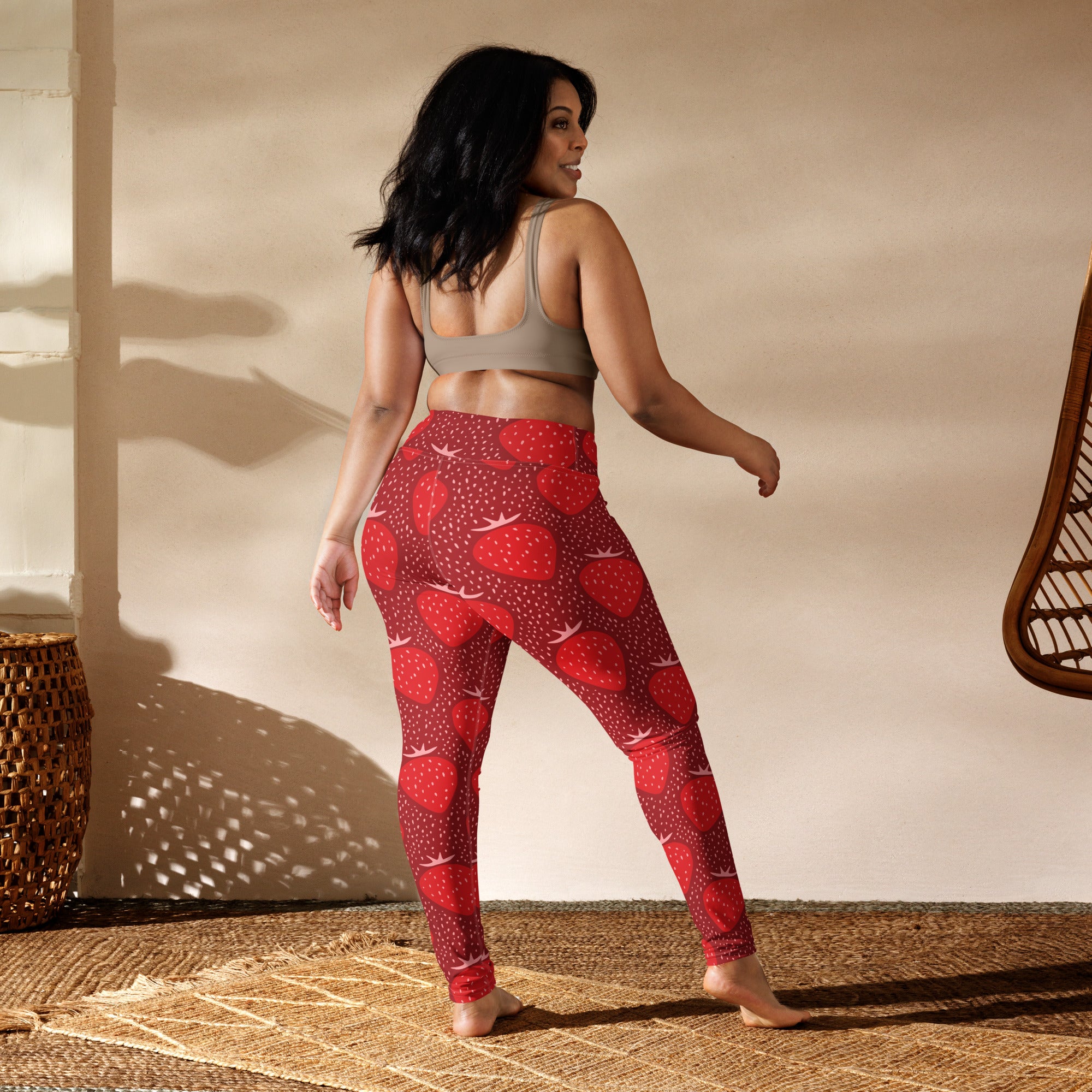 Women’s high-waisted buttery soft yoga leggings in red with strawberry pattern for comfortable workout wear