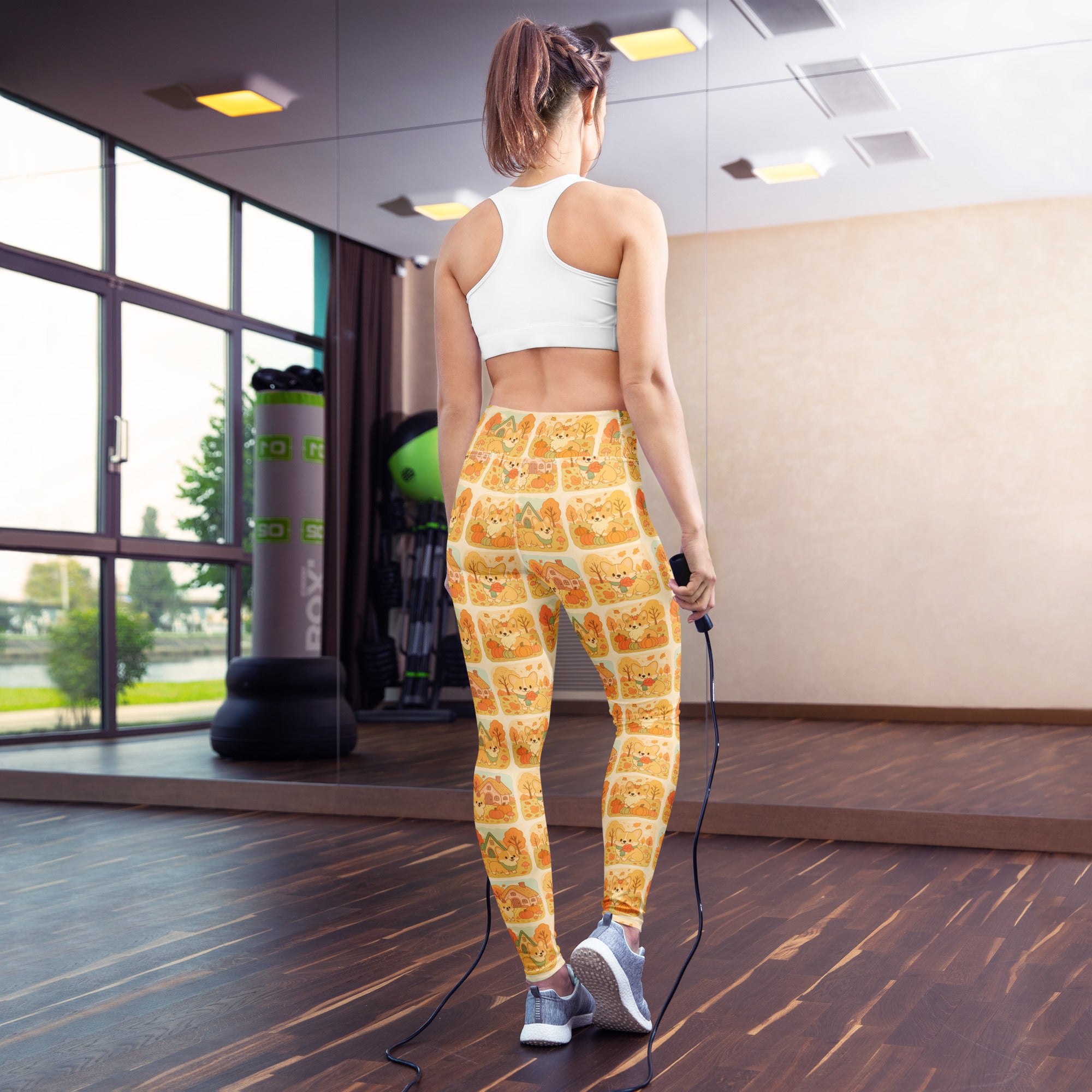 Yellow buttery soft women’s fall yoga leggings with a repeating cartoon shiba inu dog pattern