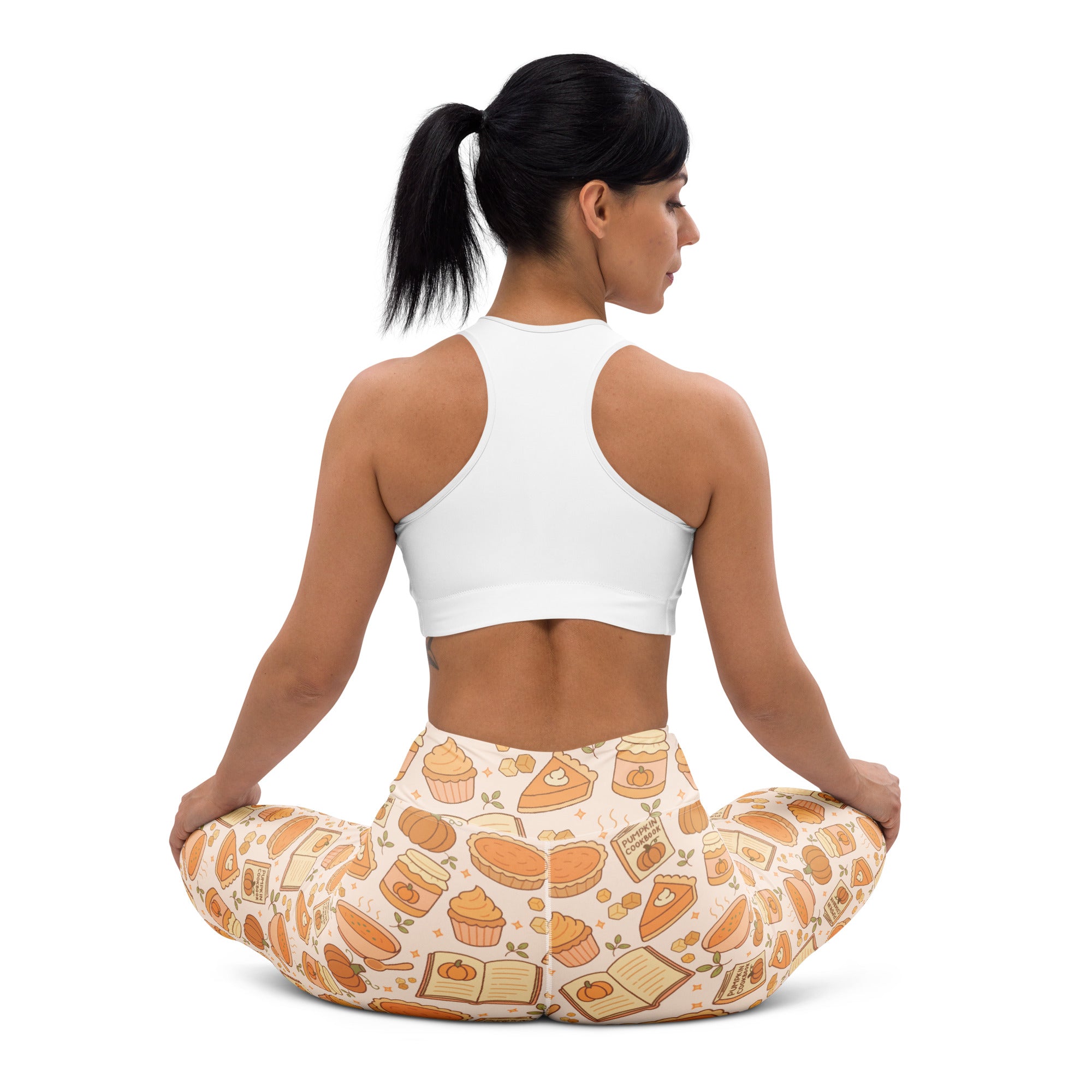 Women’s cream-colored buttery soft yoga leggings featuring an autumn pumpkin pie pattern with pies cupcakes and books
