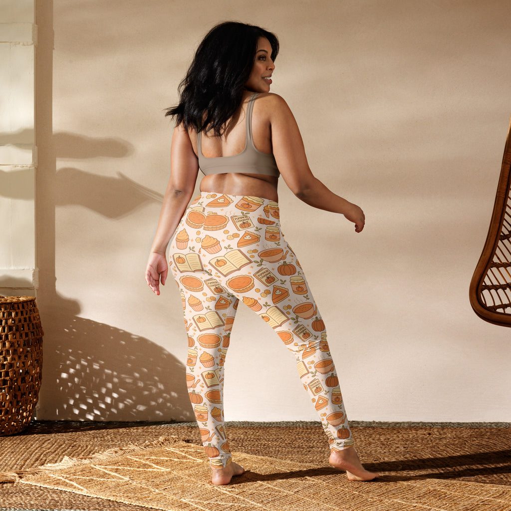 Cream-colored buttery soft women’s yoga leggings with autumn pumpkin pie themed pattern in warm orange and brown tones