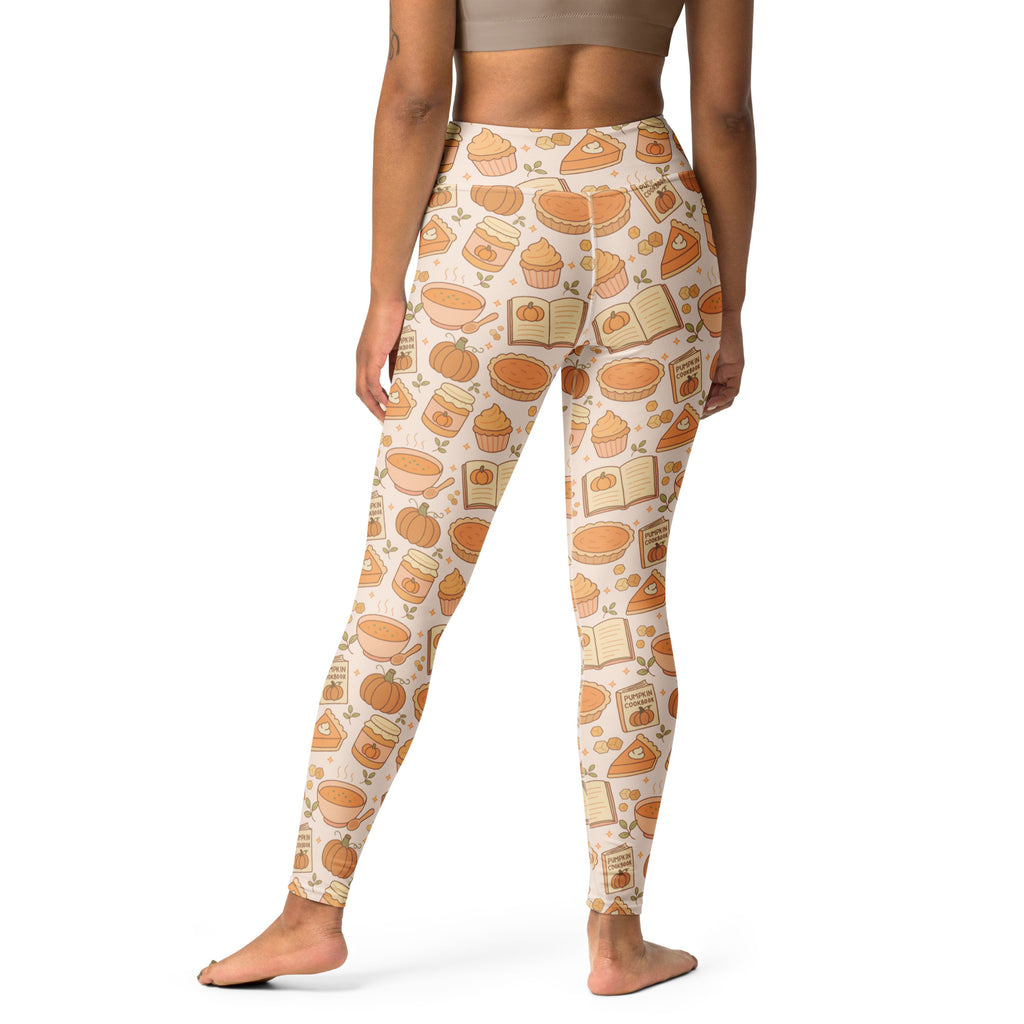 Cream-colored buttery soft women’s yoga leggings with a playful autumn pumpkin pie pattern in warm orange and brown tones