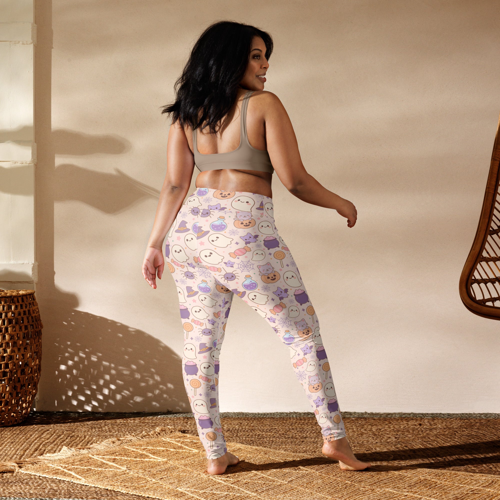 Women’s pastel halloween buttery soft yoga leggings in white with playful ghost pumpkin and candy pattern in purple and orange