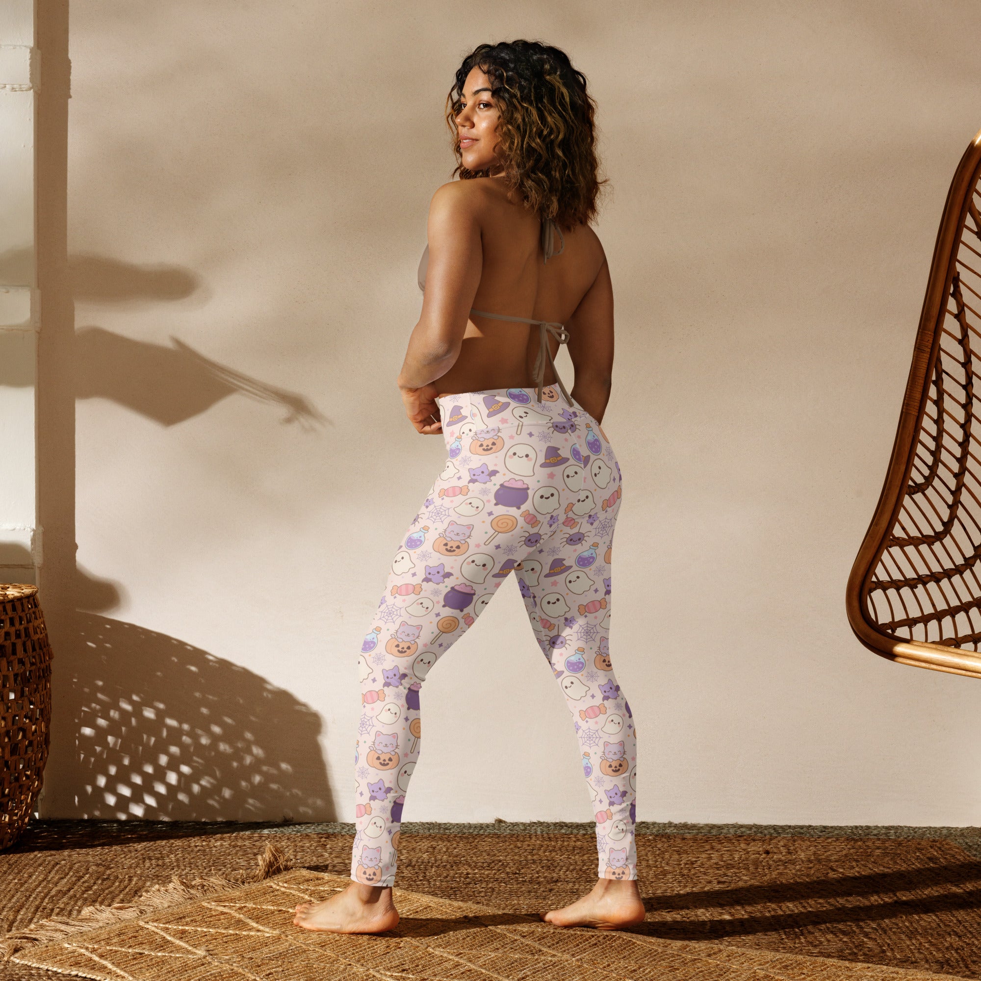 White buttery soft women’s yoga leggings with playful pastel cartoon ghosts and pumpkins halloween pattern