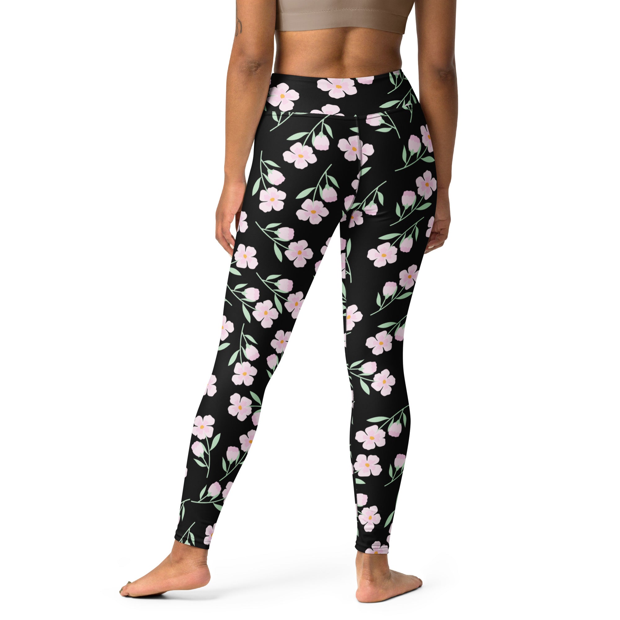 Women’s black floral buttery soft yoga leggings with pink flower and green stem pattern on soft fabric