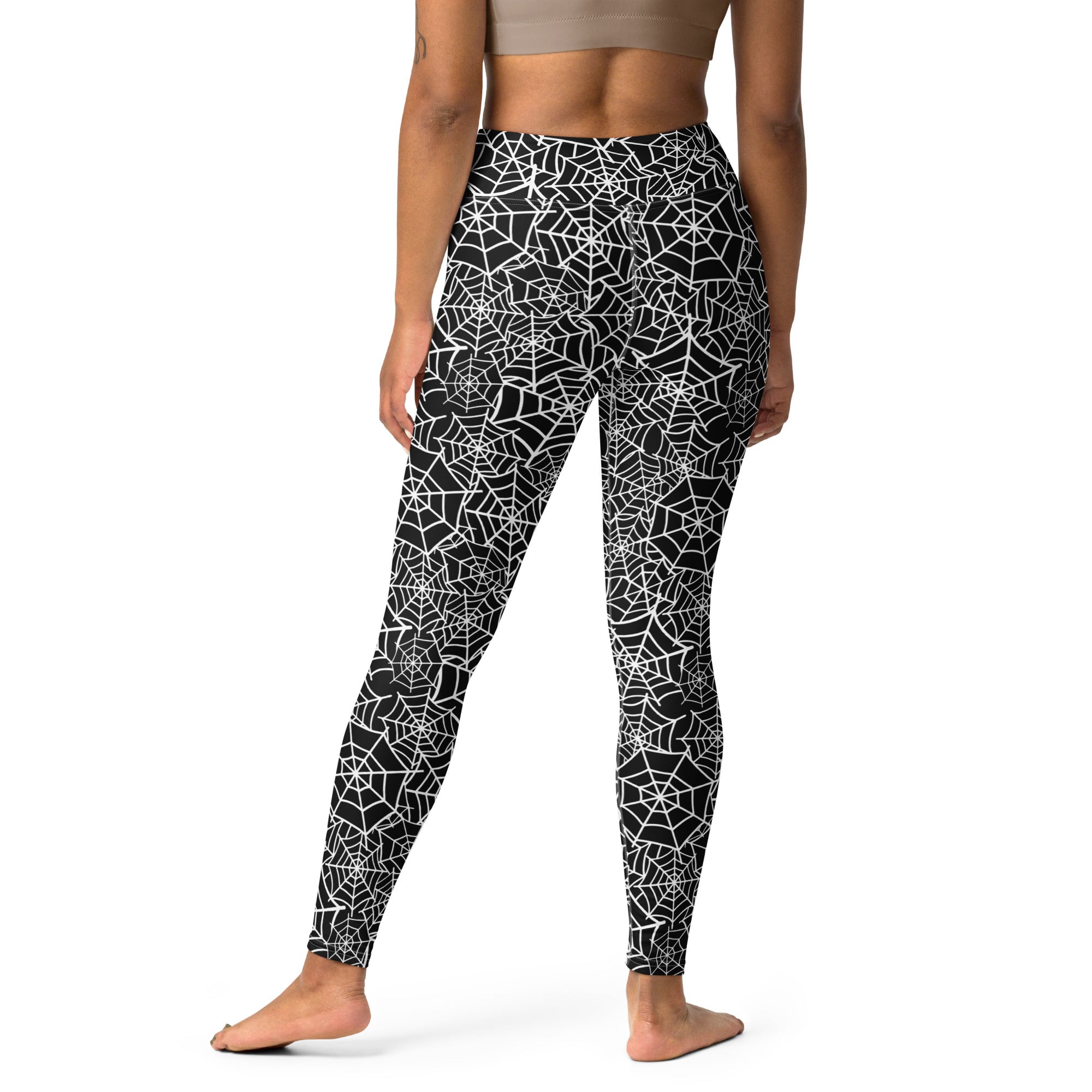 Women’s black and white spiderweb patterned high-waisted buttery soft yoga leggings for Halloween
