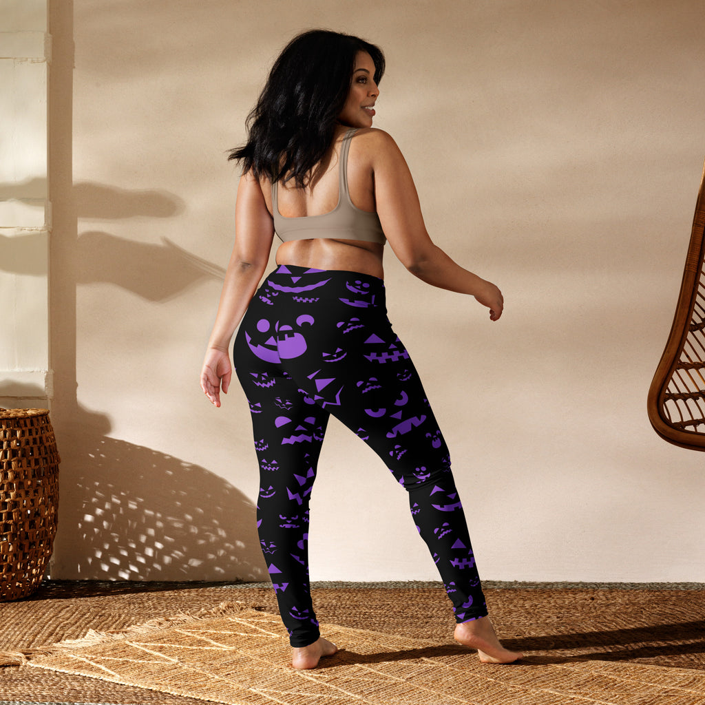 Women’s black leggings with vibrant purple jack-o-lantern faces featuring buttery soft fabric for halloween yoga