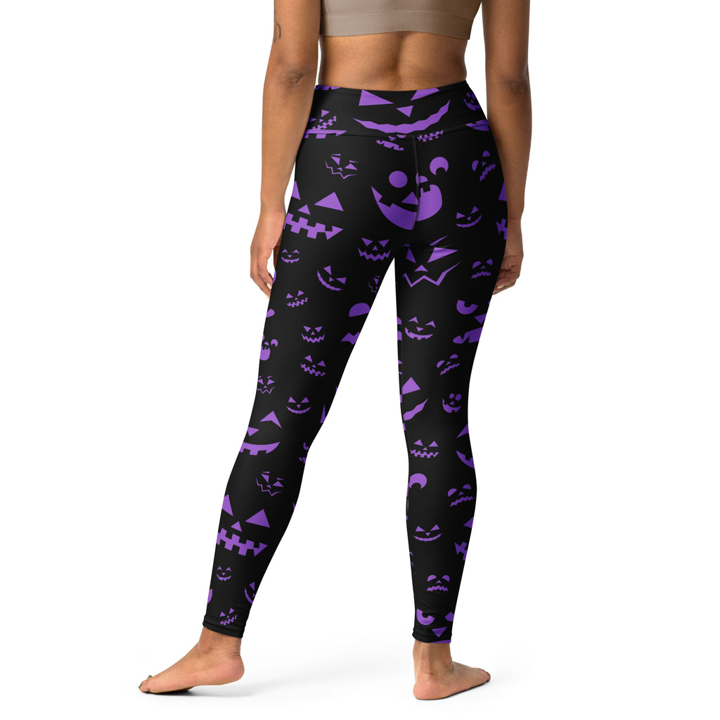 Black high-waisted buttery soft yoga leggings with vibrant purple jack-o-lantern faces for halloween women