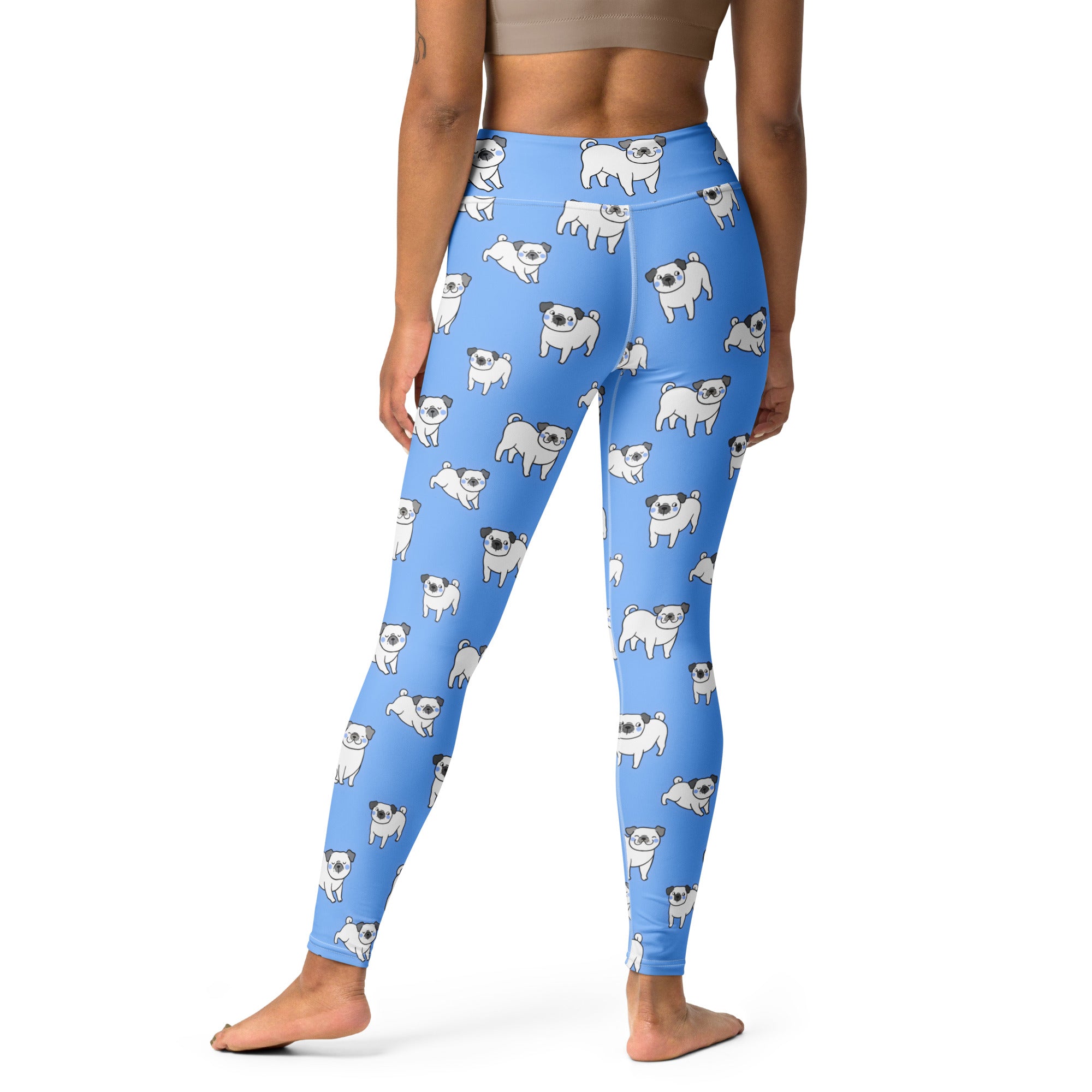 Women’s blue buttery soft yoga leggings with a repeating pattern of white cartoon pugs