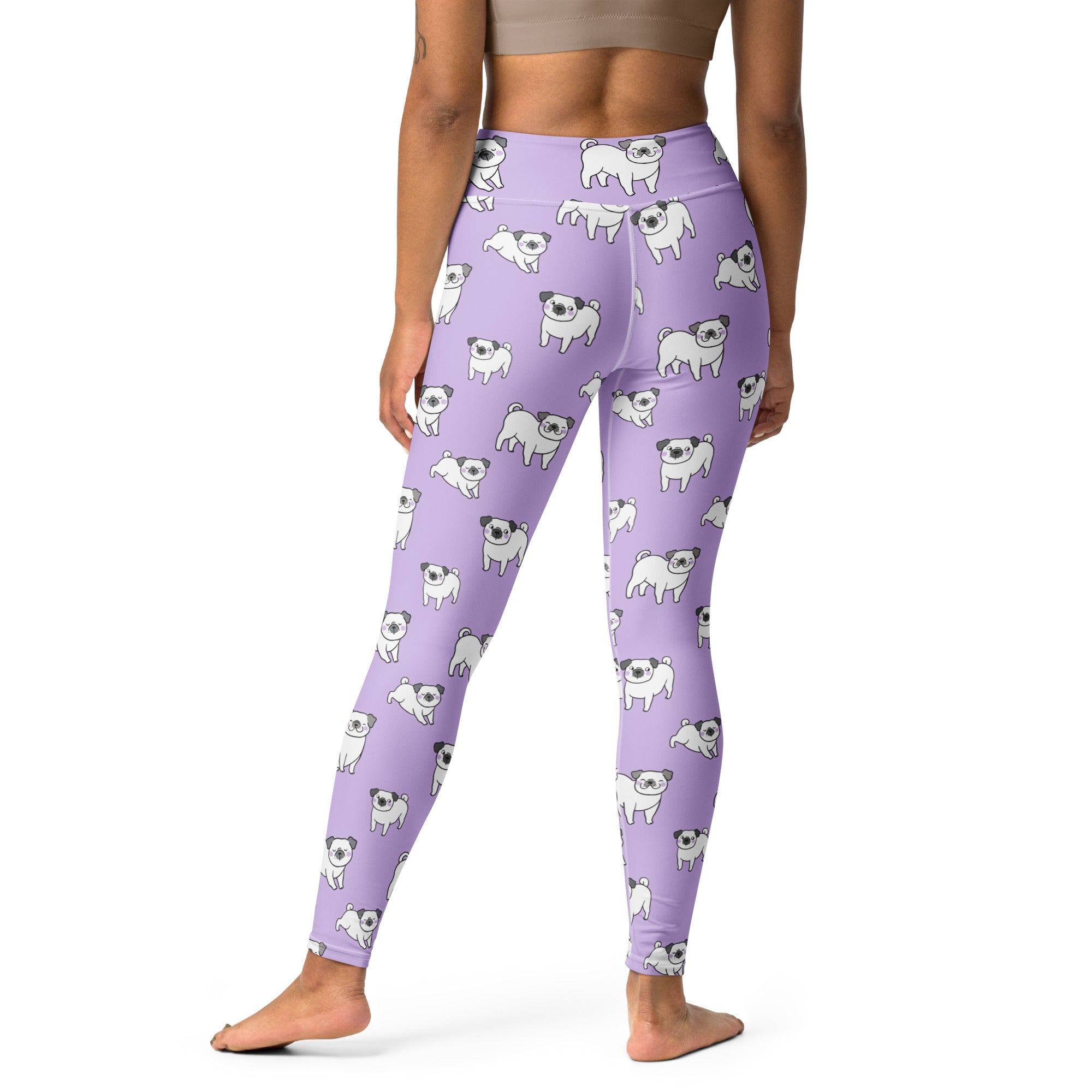 Women’s purple buttery soft yoga leggings with white cartoon pug pattern perfect for comfortable workouts