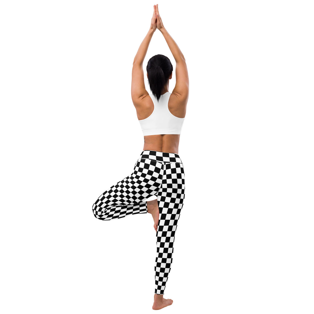 Women’s checkerboard buttery soft yoga leggings in black and white checkered pattern shown from the back side