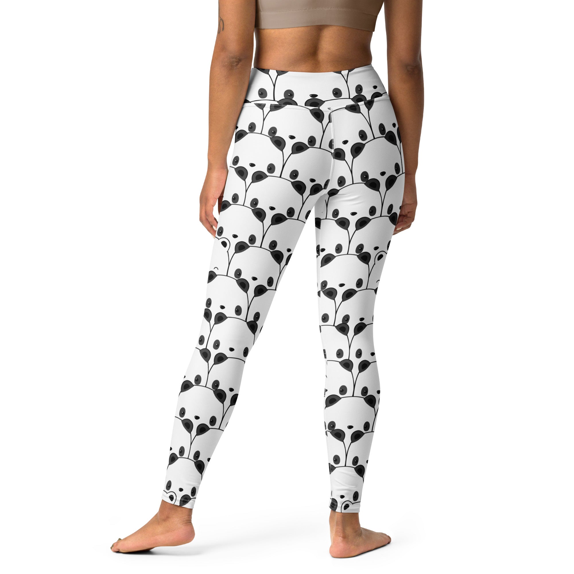 White high-waisted buttery soft yoga leggings with repeating black panda face pattern for women