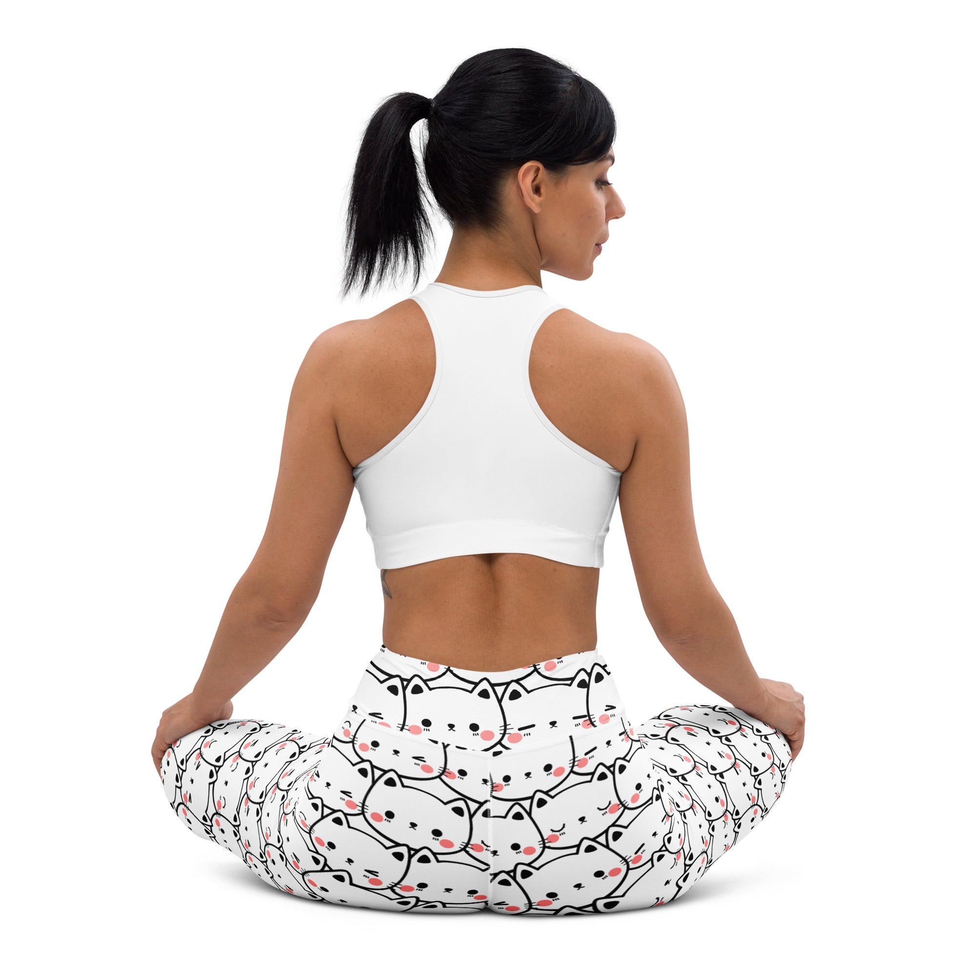 White buttery soft women’s yoga leggings with a playful black outlined cartoon cat print and pink cheeks pattern