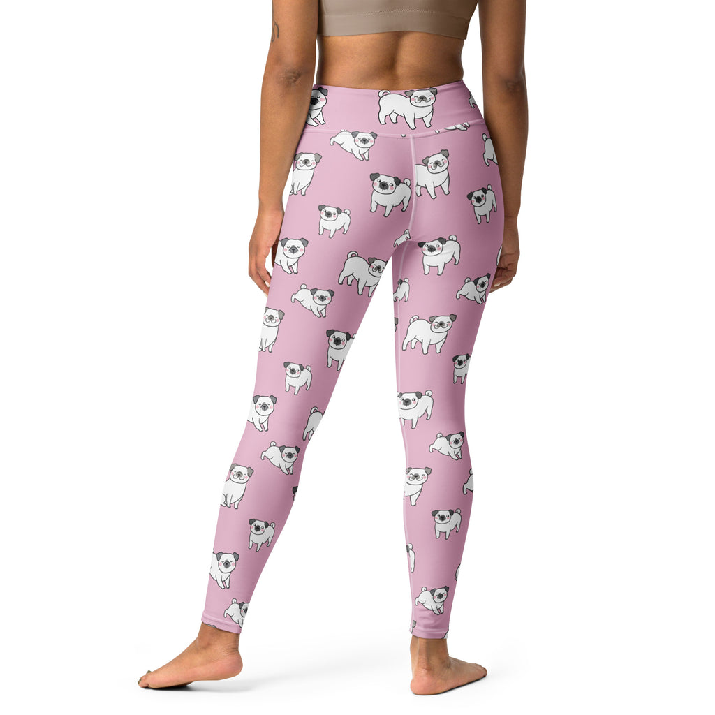 Women’s pink buttery soft yoga leggings with a repeating pattern of white and black cartoon pugs