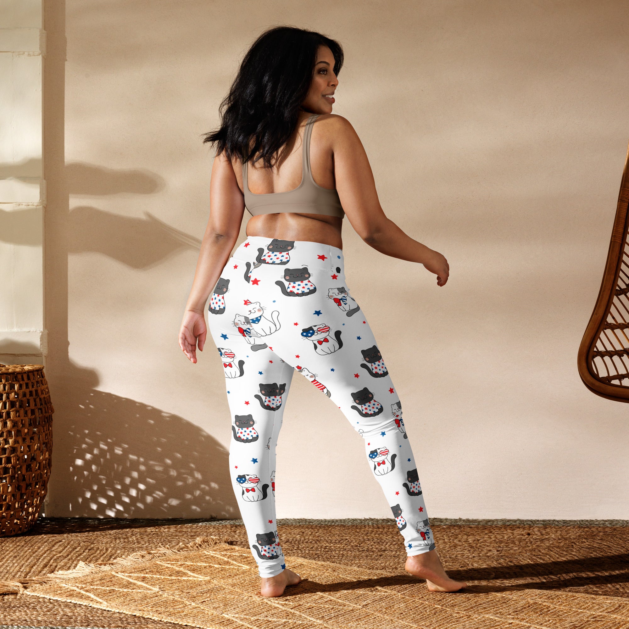 White buttery soft women’s yoga leggings with black and white cats wearing american flag accessories and red stars