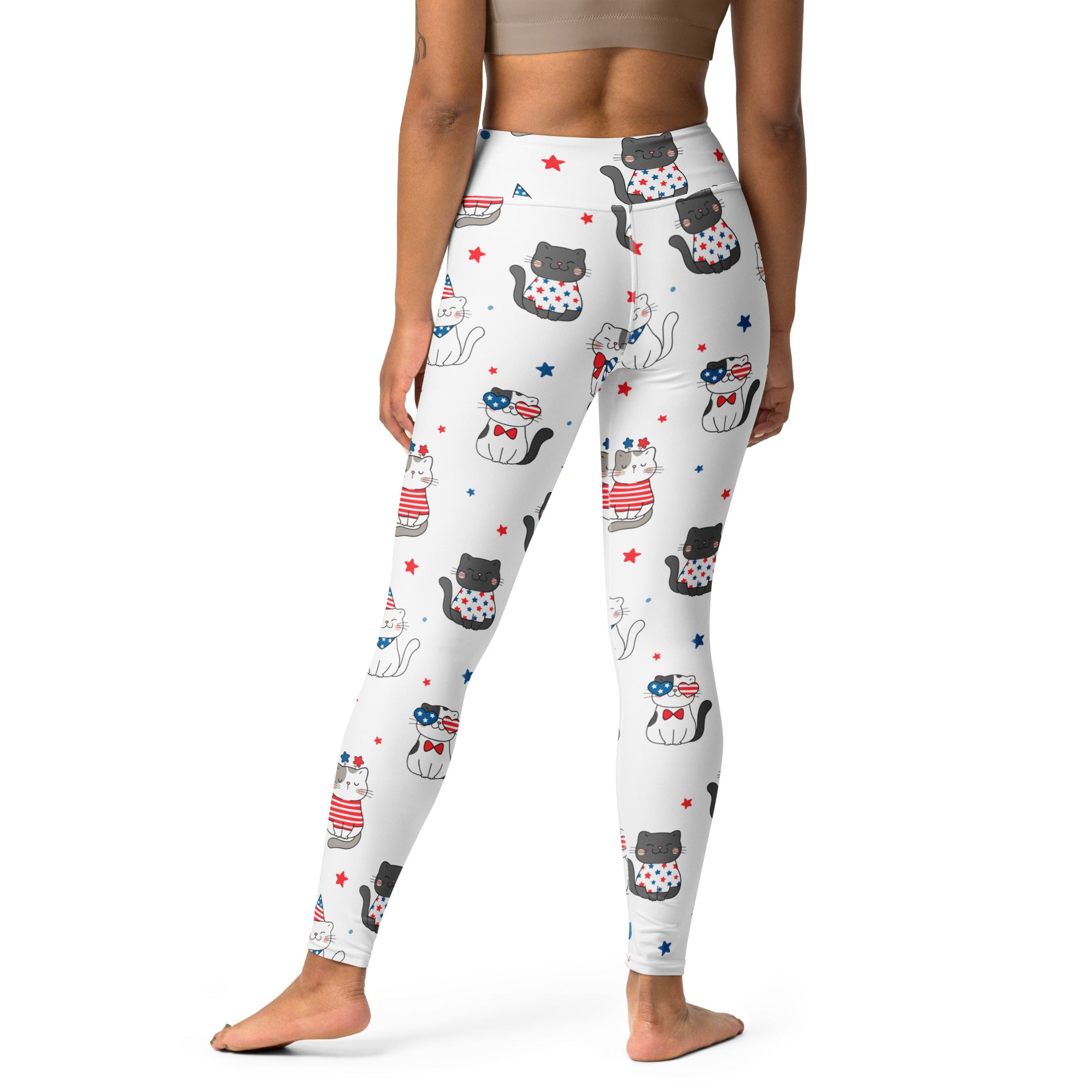 White buttery soft yoga leggings with a playful pattern of cartoon cats in red white and blue patriotic outfits and stars