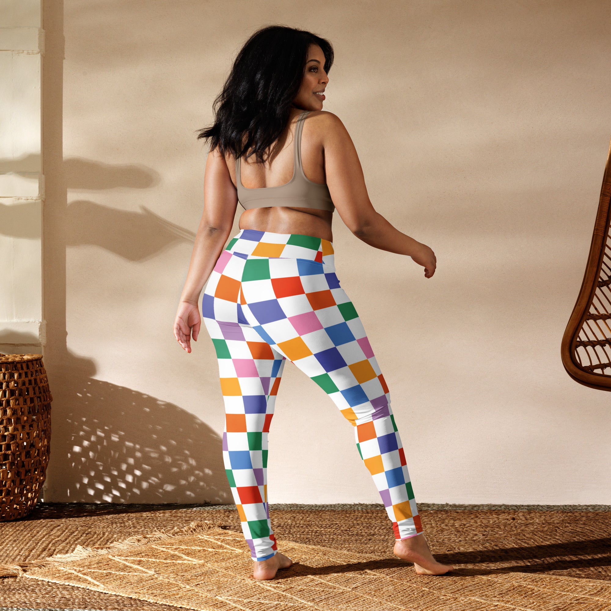 Women’s colorful checkered buttery soft yoga leggings with a vibrant rainbow pattern for active wear