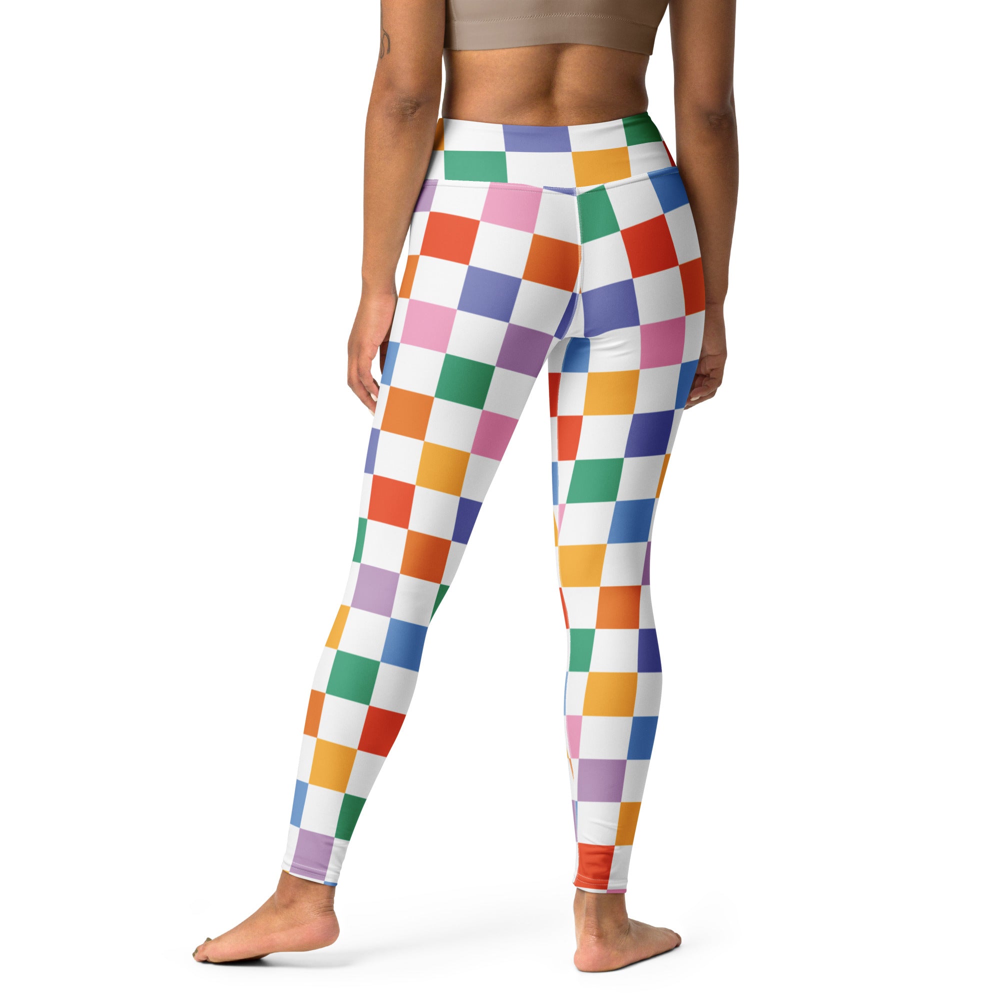Women’s colorful checkered buttery soft yoga leggings with vibrant rainbow pattern on white background