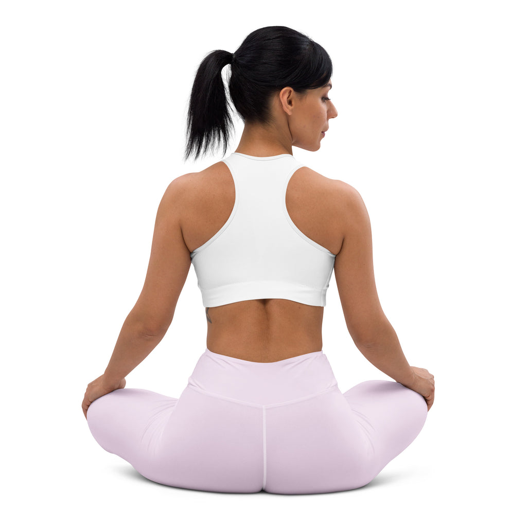 White racerback sports bra paired with light purple buttery soft high waisted yoga leggings front view