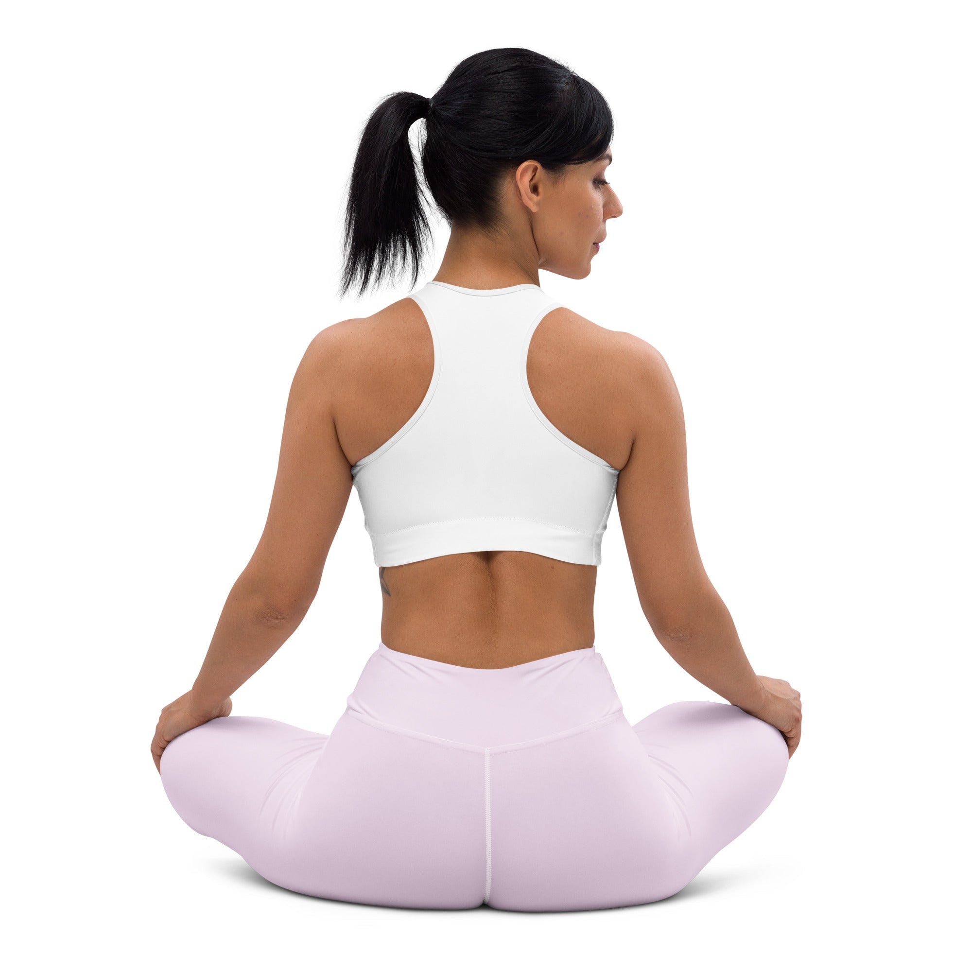 White racerback sports bra paired with light purple buttery soft high waisted yoga leggings front view