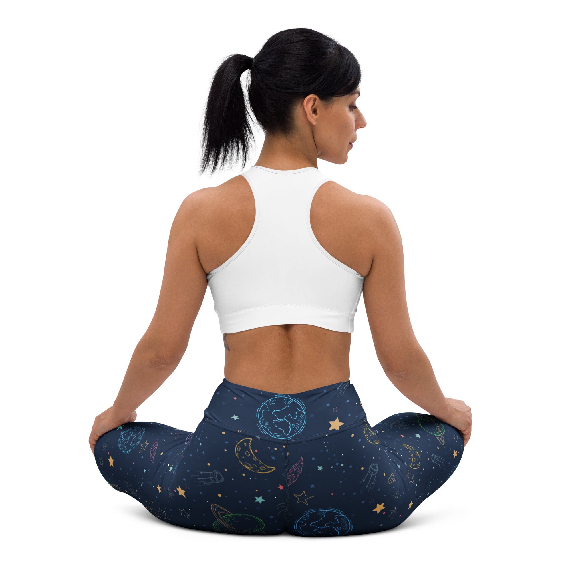 Women’s colorful galaxy space buttery soft yoga leggings in dark blue with glowing pastel planets moons and stars design