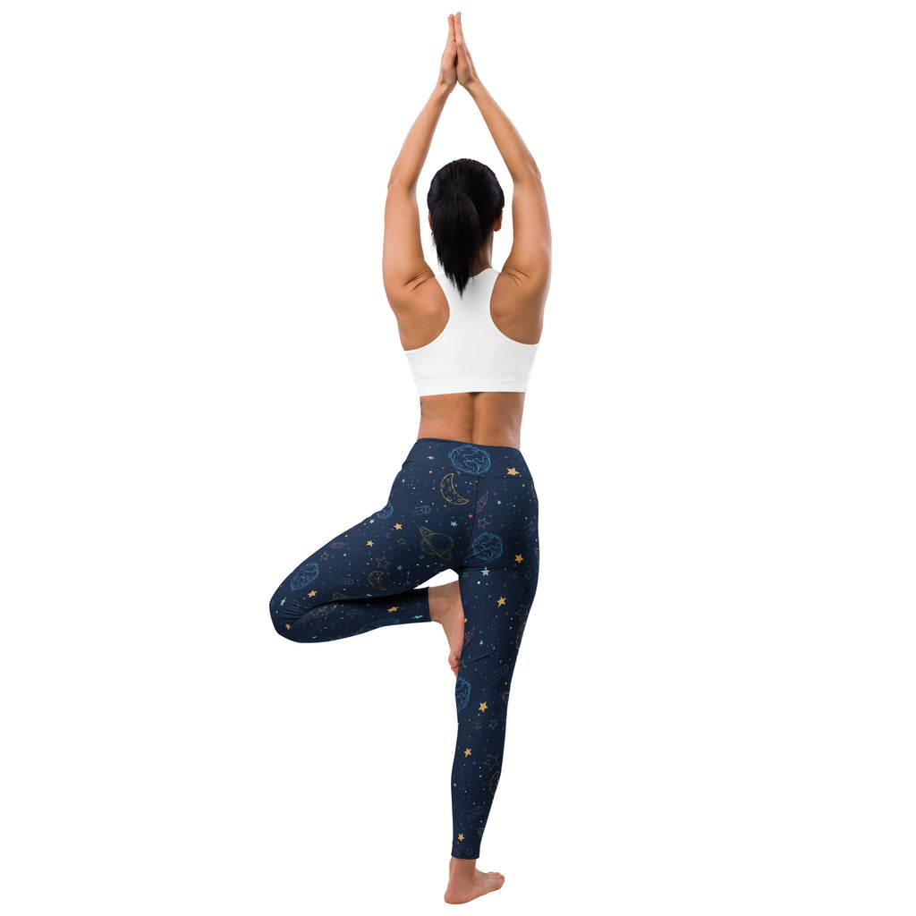 Women’s dark blue buttery soft yoga leggings with colorful celestial moons stars and planets pattern