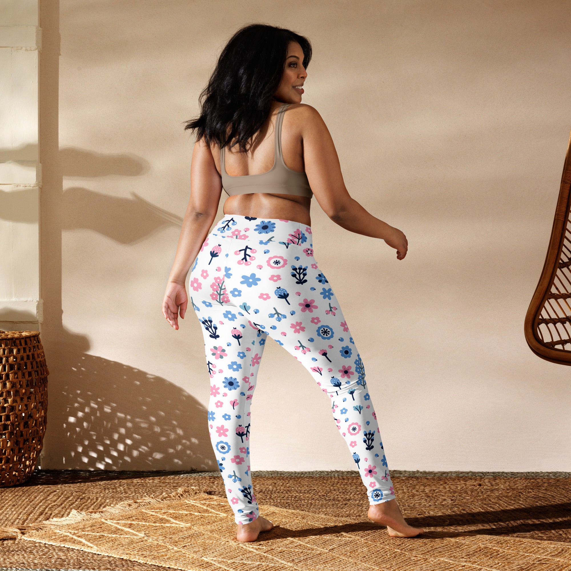 White women’s buttery soft yoga leggings with pastel floral pattern in pink blue and black