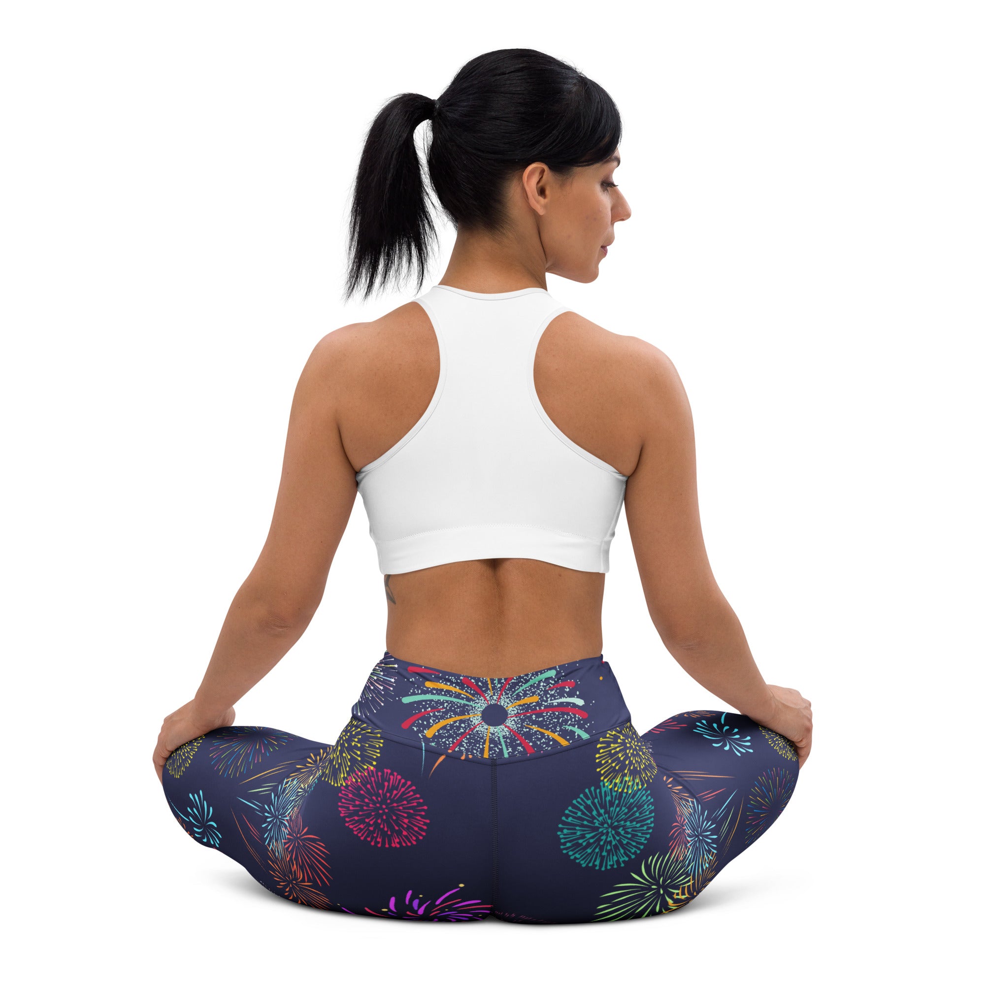 Dark blue women’s buttery soft yoga leggings with vibrant multicolored fireworks pattern for activewear