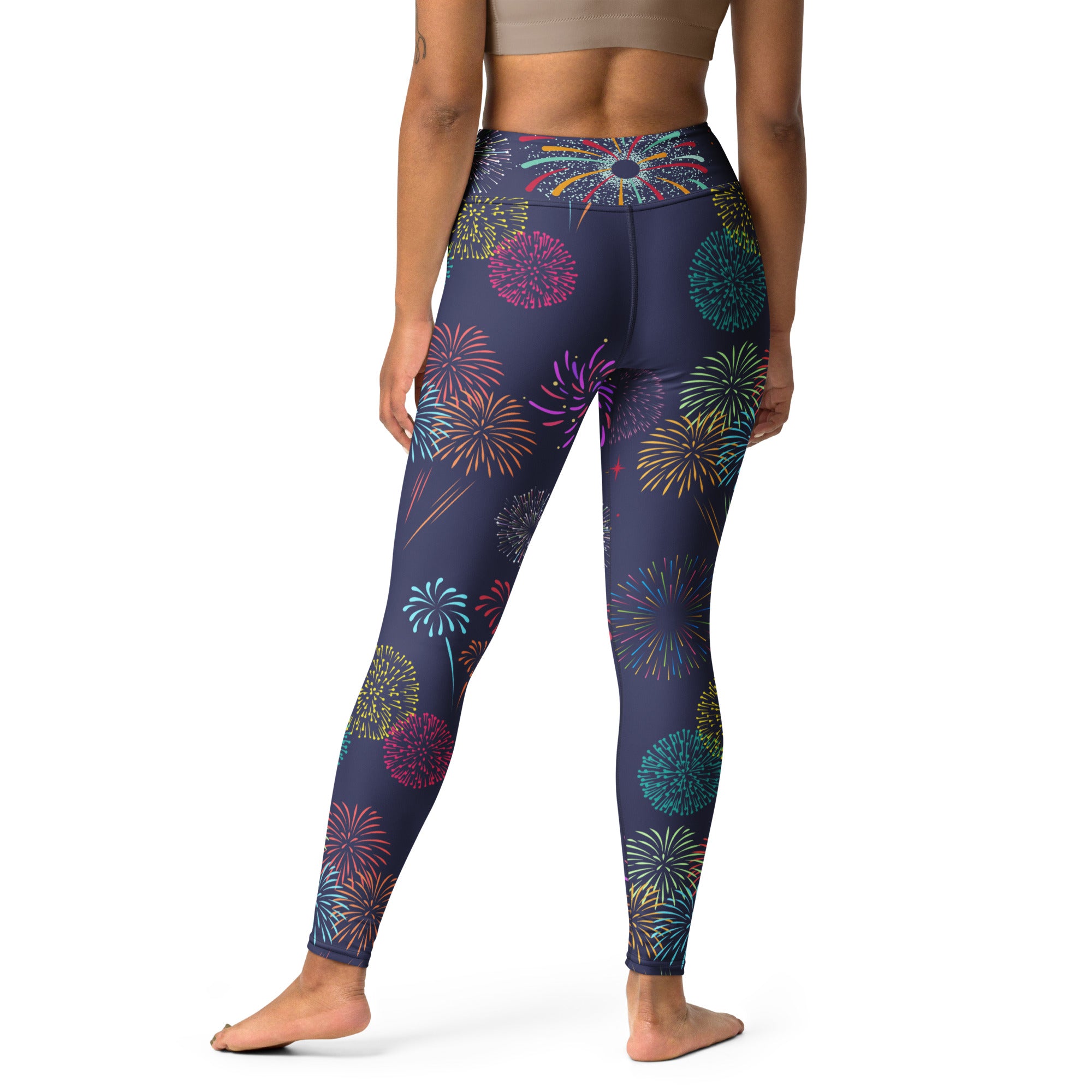 Dark blue high waisted women’s yoga leggings with a vibrant multicolored fireworks pattern and buttery soft fabric
