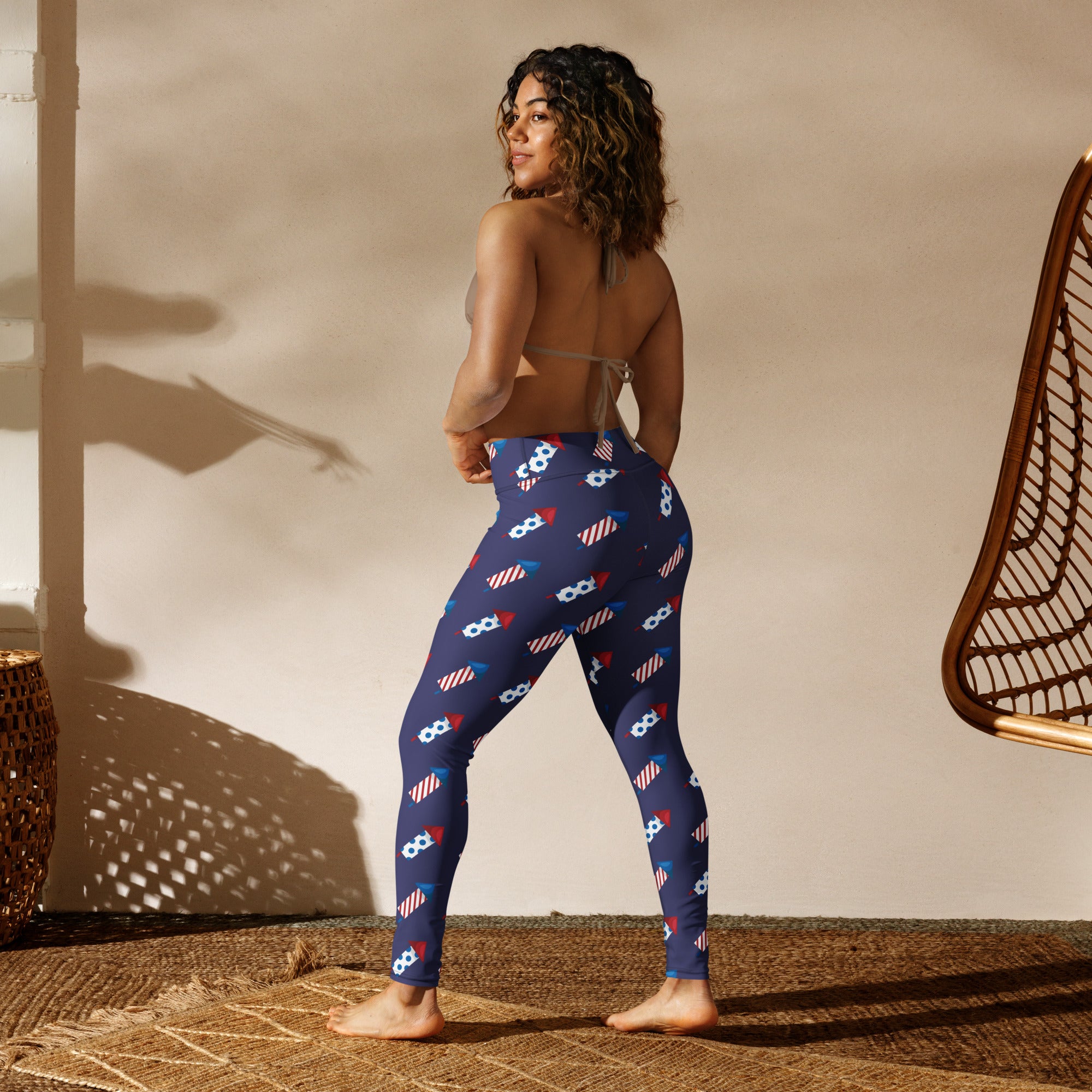 Navy blue buttery soft women’s yoga leggings with red white and blue rocket ship pattern for 4th of July