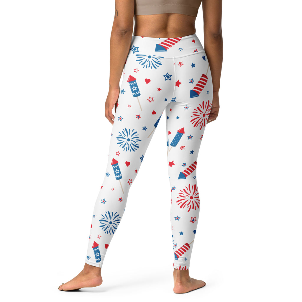 White high-waisted buttery soft yoga leggings with vibrant red and blue fireworks stars and rockets pattern