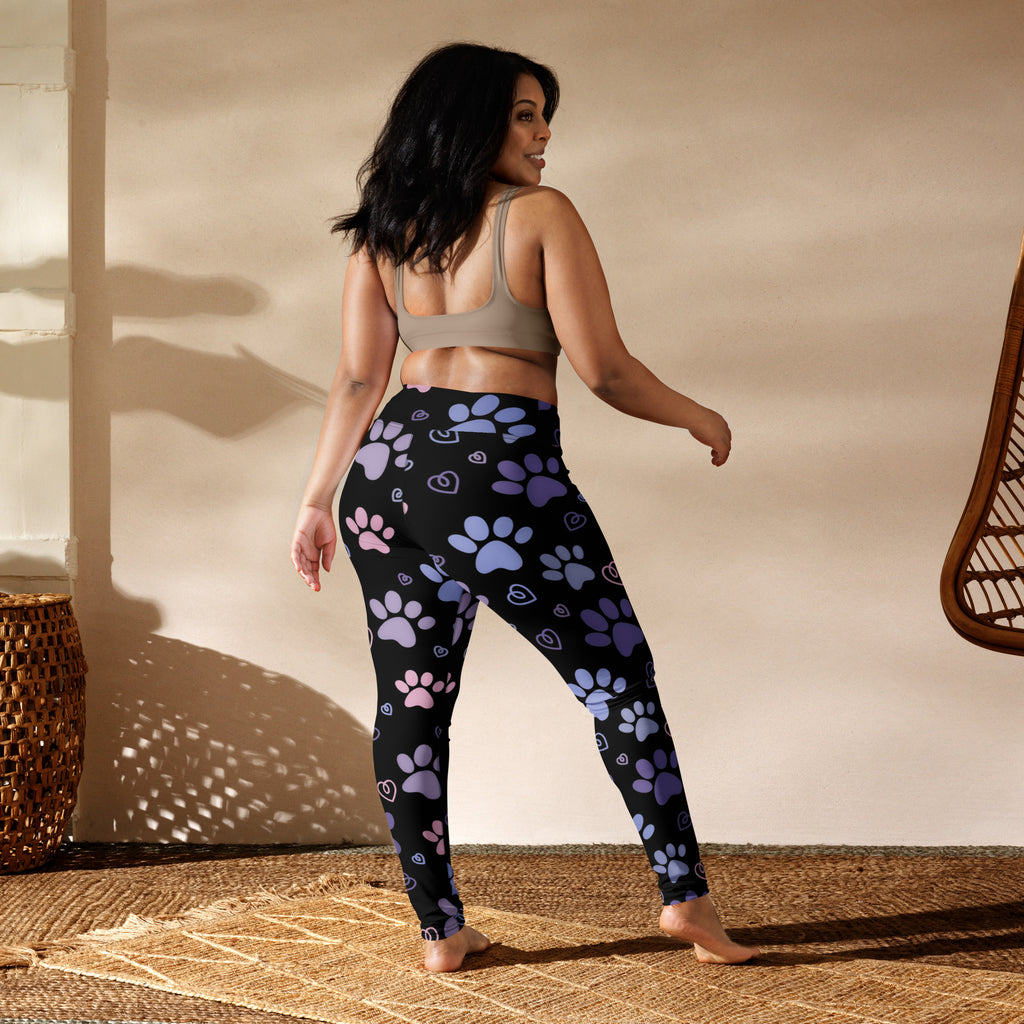 Black buttery soft leggings with playful purple and pink paw prints and hearts ideal for women’s yoga