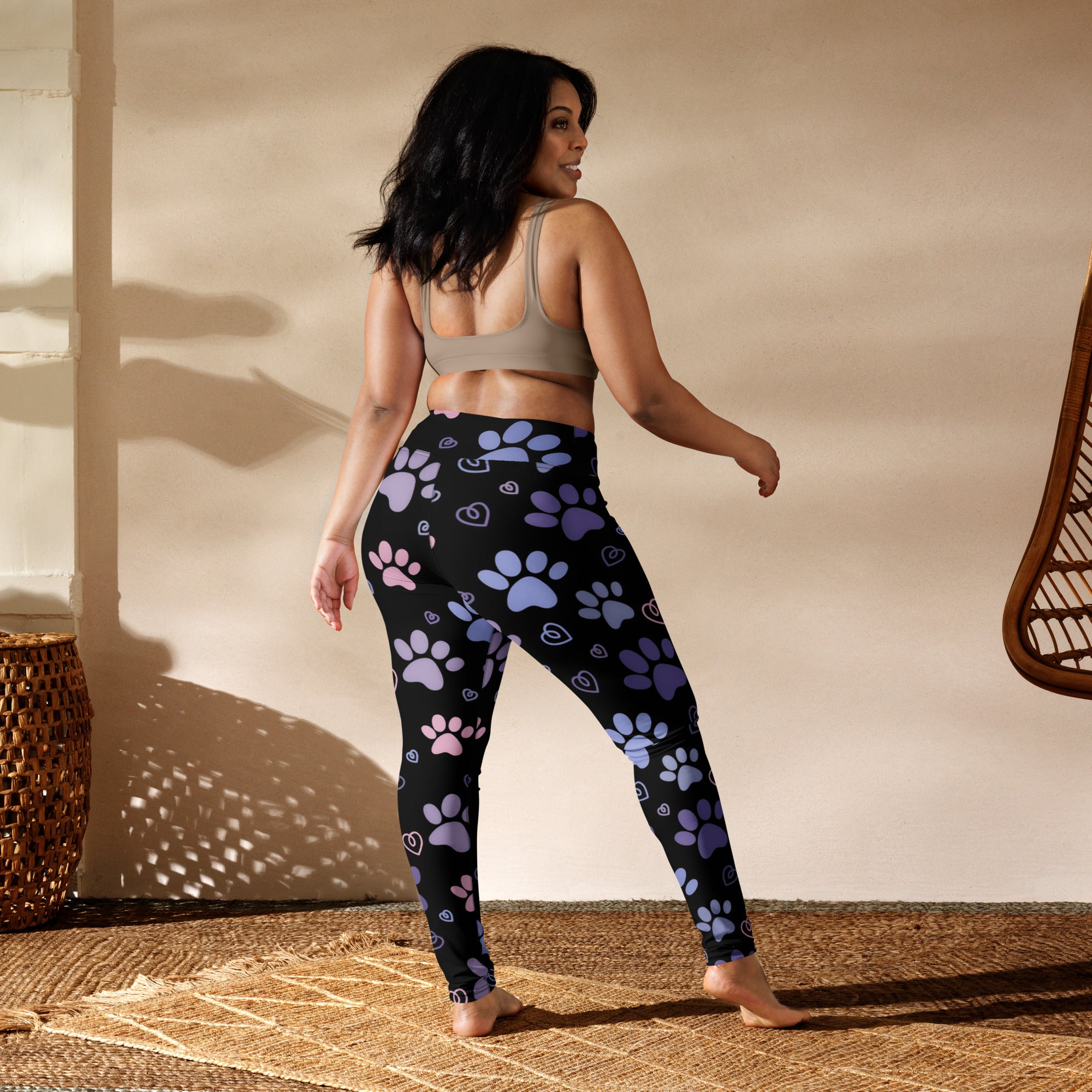 Black buttery soft leggings with playful purple and pink paw prints and hearts ideal for women’s yoga