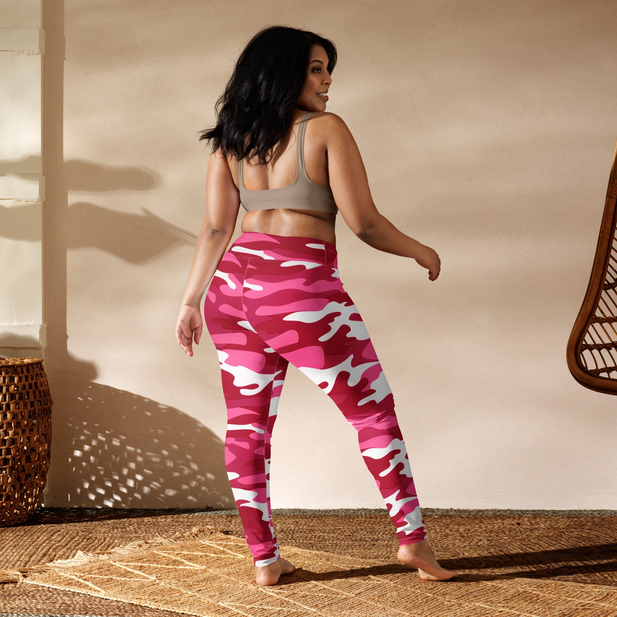 Women’s pink and white camouflage buttery soft yoga leggings shown from the back with a comfortable fit