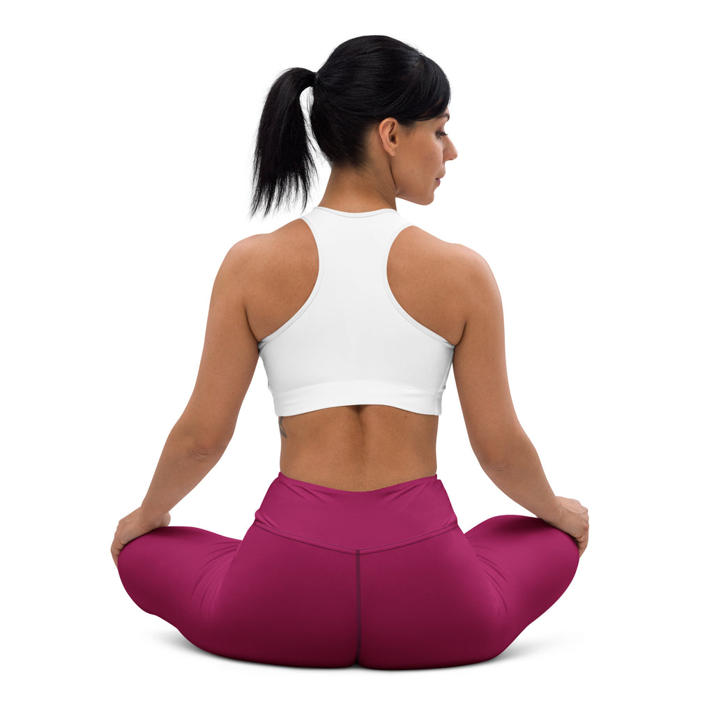 A woman wearing women’s dark magenta buttery soft high-waisted yoga leggings in a seated yoga pose