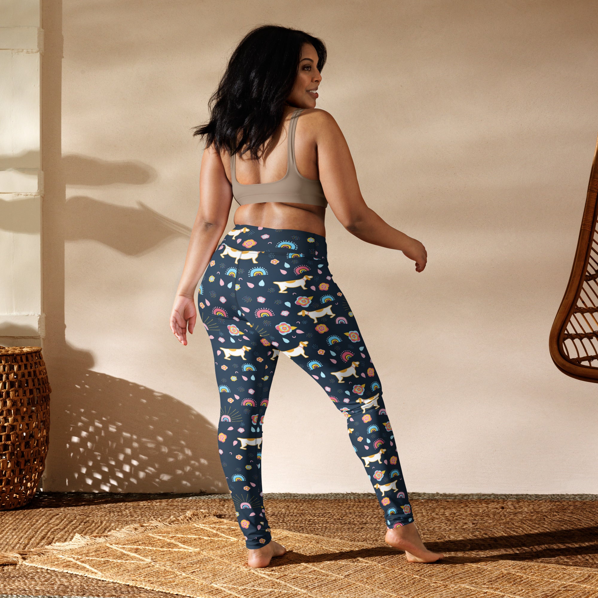 Dark blue buttery soft women’s yoga leggings with white dachshunds rainbows and pastel flowers pattern