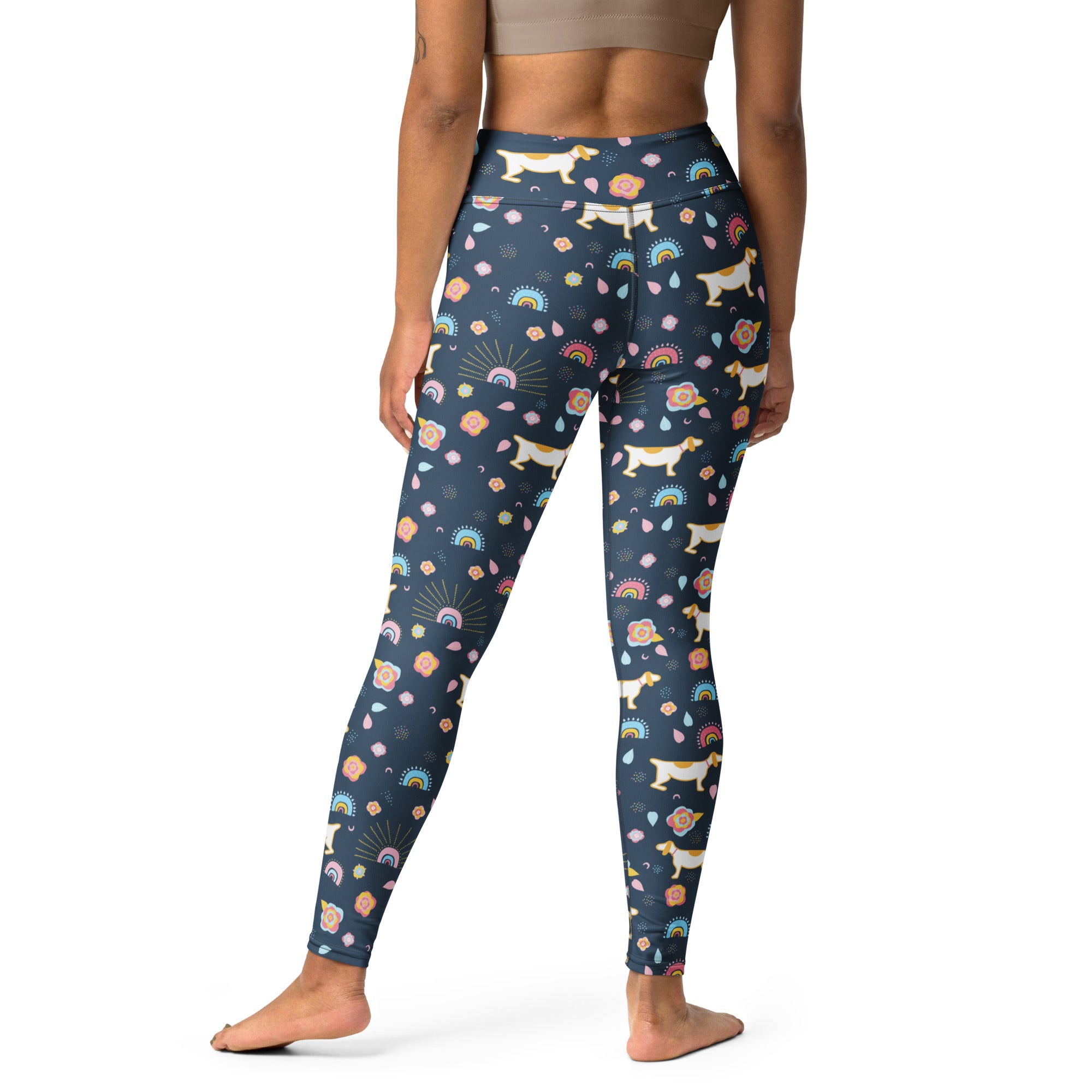 Dark blue high waisted buttery soft yoga leggings with playful corgi pattern rainbows flowers and sunbursts