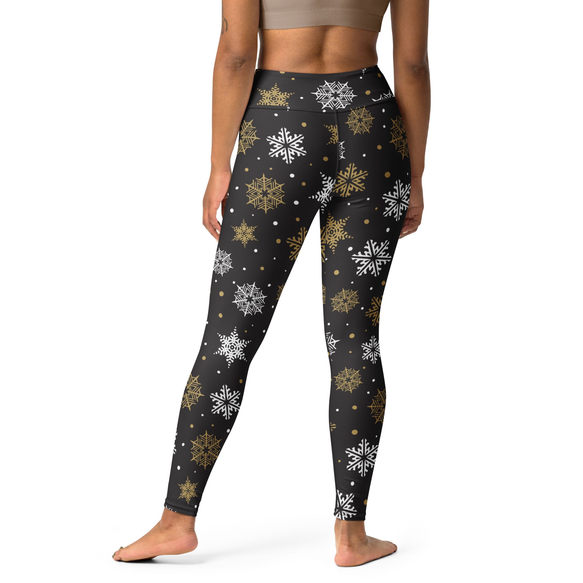 Women’s gold and white snowflake buttery soft black leggings with festive snowflake pattern for yoga and casual wear