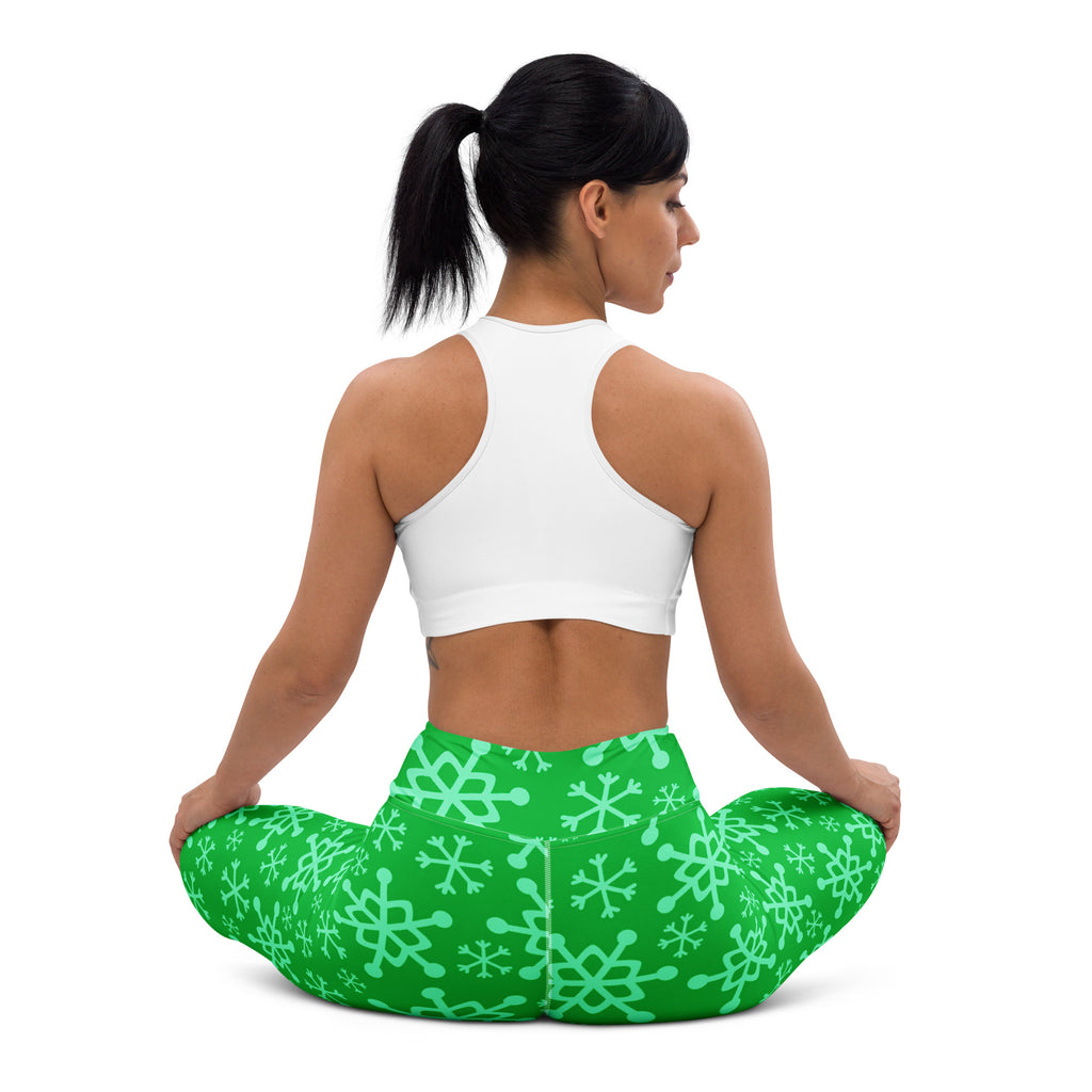 Women’s green snowflake buttery soft yoga leggings featuring a comfortable fit and vibrant seasonal pattern