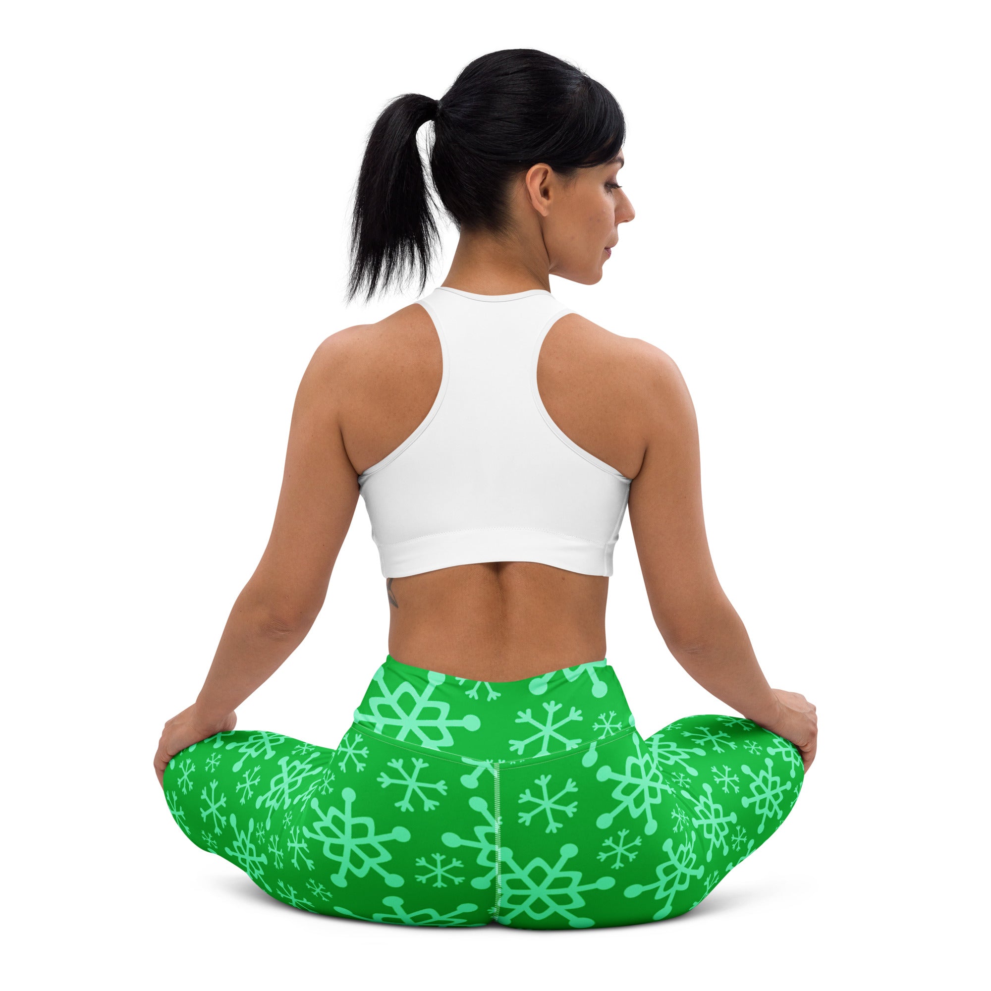 Women’s green snowflake buttery soft yoga leggings featuring a comfortable fit and vibrant seasonal pattern