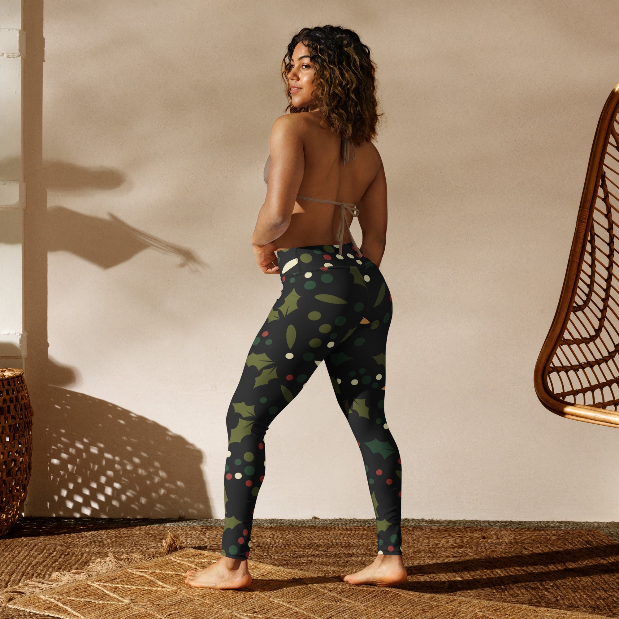 Women’s holly berry buttery soft yoga leggings in black with festive green holly leaves and multicolored polka dots