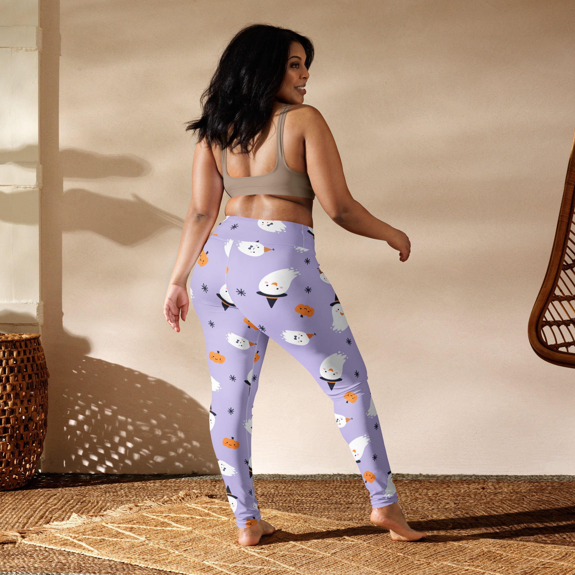 Lavender buttery soft women’s yoga leggings with playful halloween pattern of white ghosts and orange pumpkins
