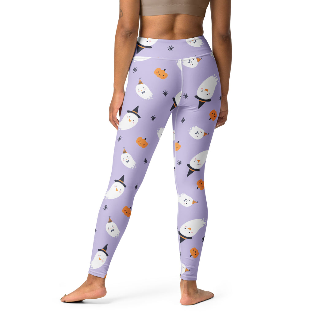 Women’s purple buttery soft yoga leggings with playful white ghost and orange pumpkin pattern for halloween fun