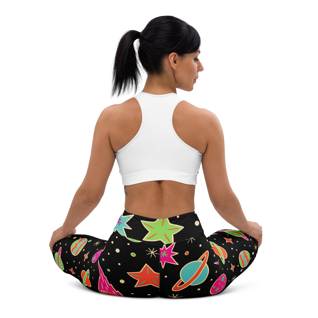 Women’s neon galaxy buttery soft black leggings with vibrant retro space design in neon pink green orange and teal colors