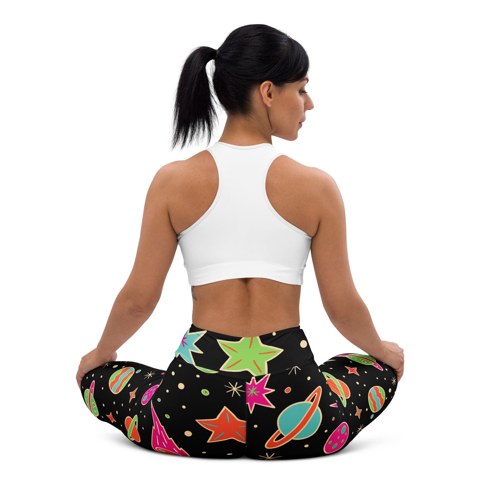 Women’s neon galaxy buttery soft black leggings with vibrant retro space design in neon pink green orange and teal colors