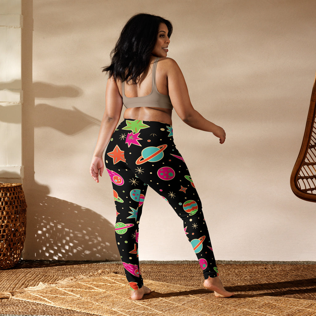 Women’s neon galaxy buttery soft yoga leggings in black with vibrant space-themed planets stars and saturn rings pattern