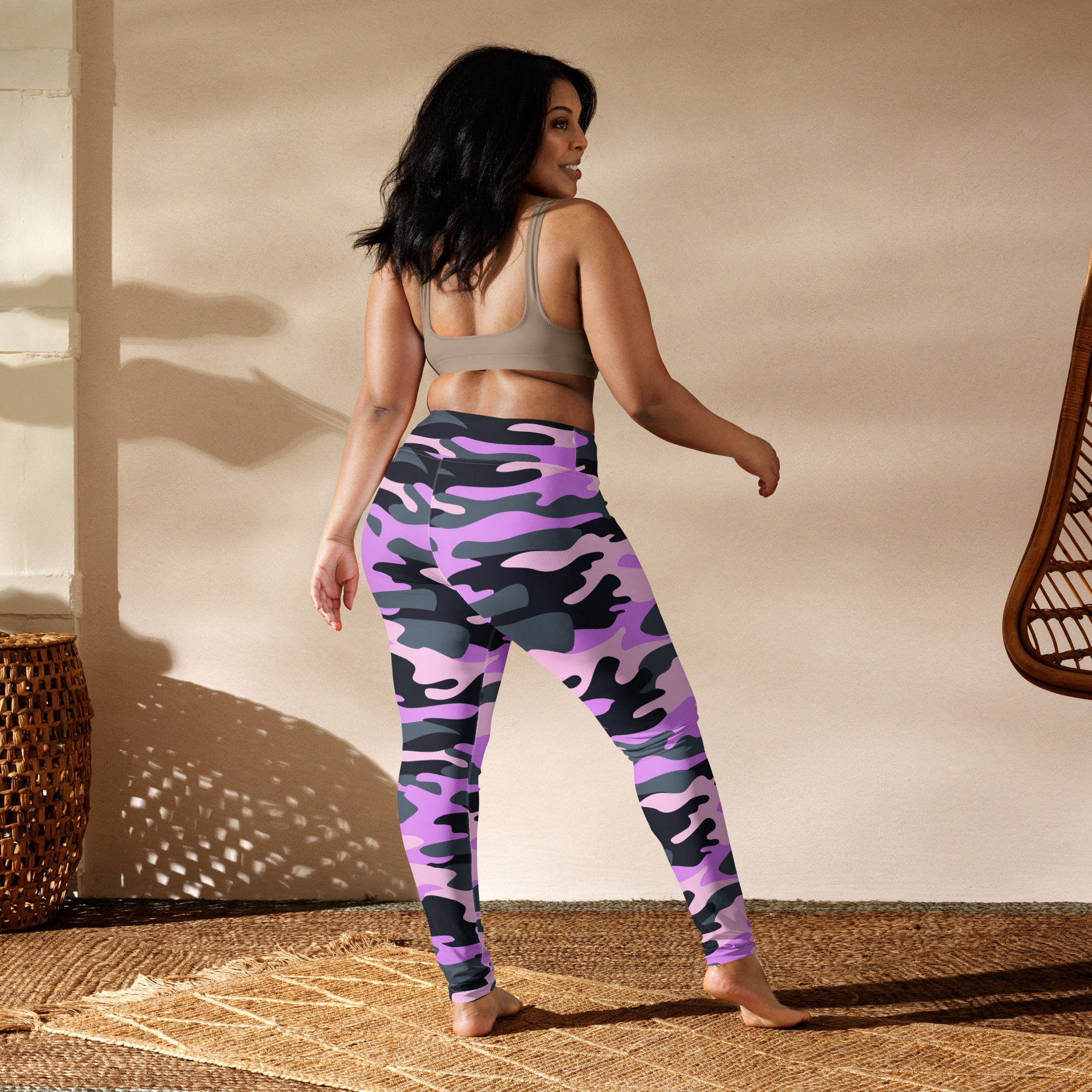 Women’s purple and black camouflage high-waisted buttery soft yoga leggings shown from the back