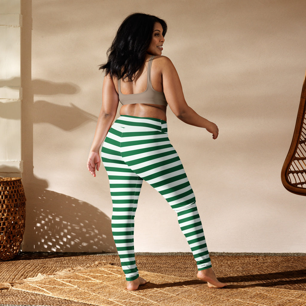 Women’s green and white striped high-waisted buttery soft yoga leggings shown from the back side