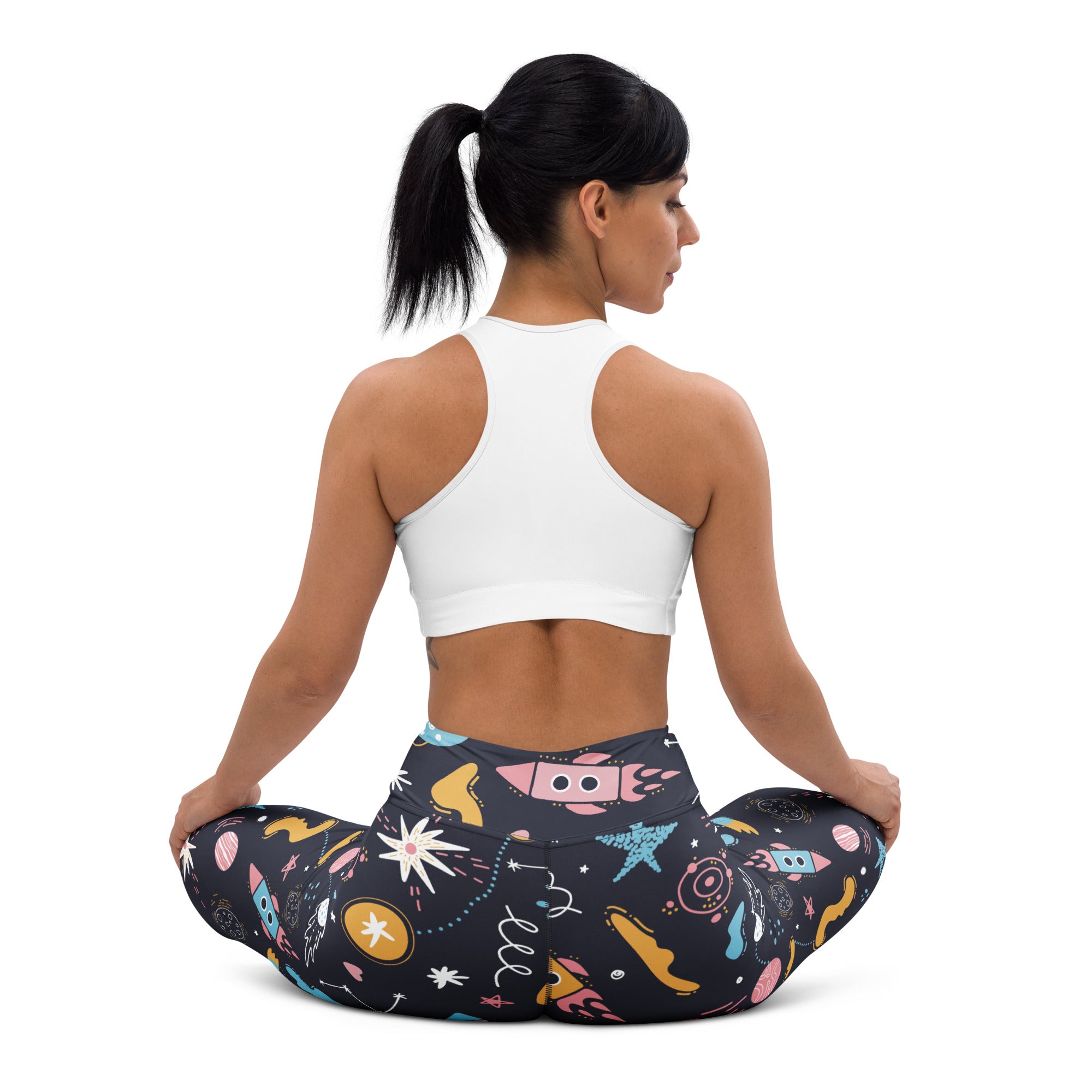 Women’s outer space buttery soft black yoga leggings with colorful rockets stars and planets space-themed pattern
