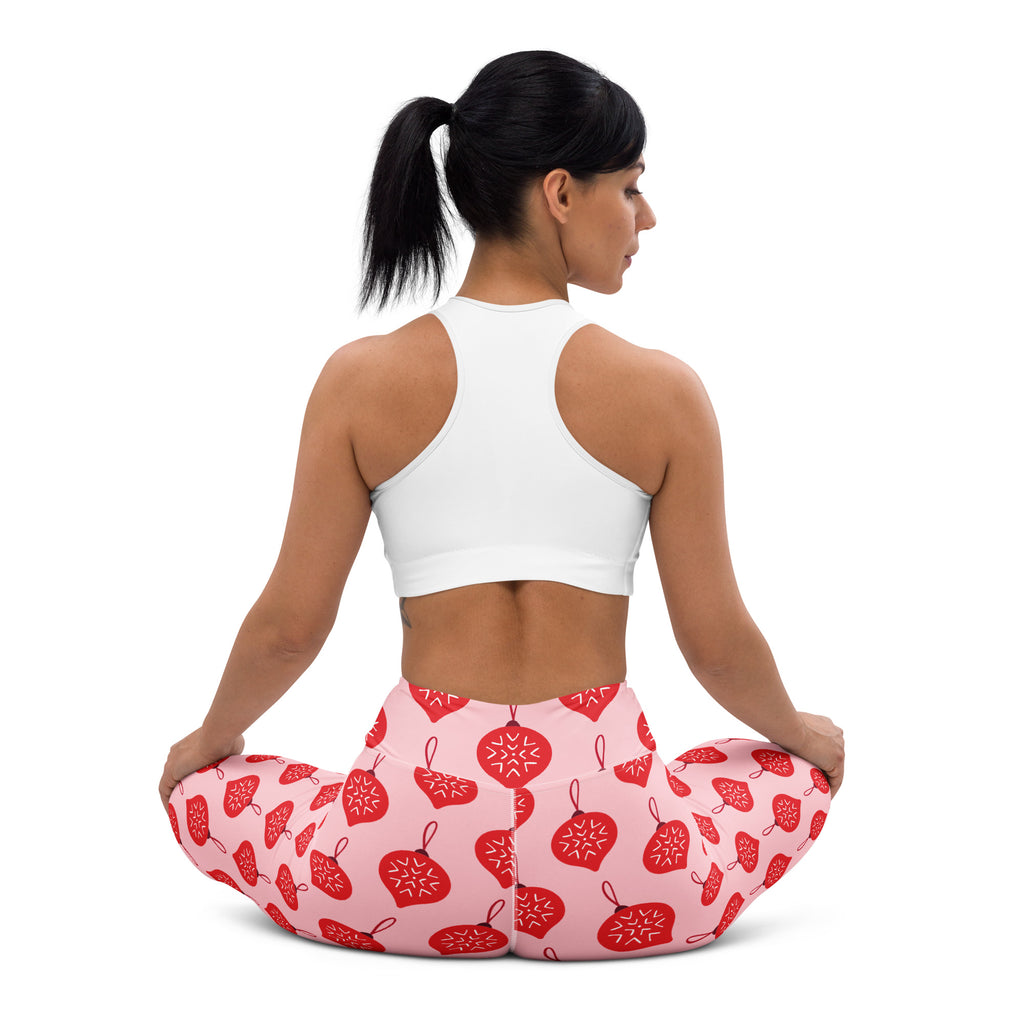 Women’s buttery soft pink leggings with red christmas ornament patterns perfect for yoga and festive wear
