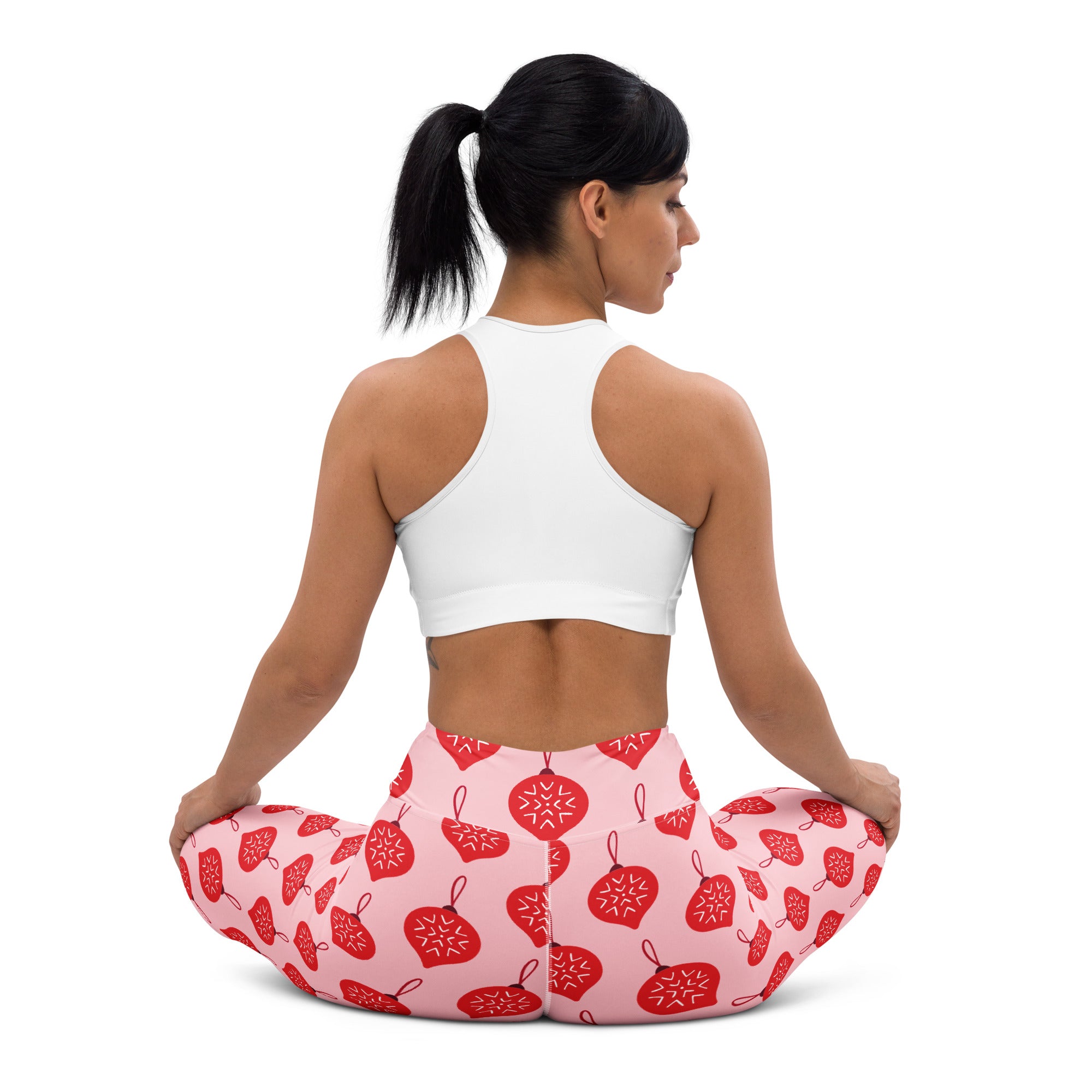 Women’s buttery soft pink leggings with red christmas ornament patterns perfect for yoga and festive wear